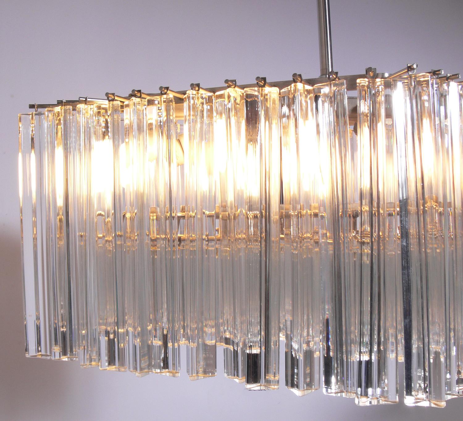 Italian crystal prisms chandelier by Camer, Italy, circa 1960s. Looks incredible when lit. Constructed of a nickel-plated metal armature and crystal prisms.