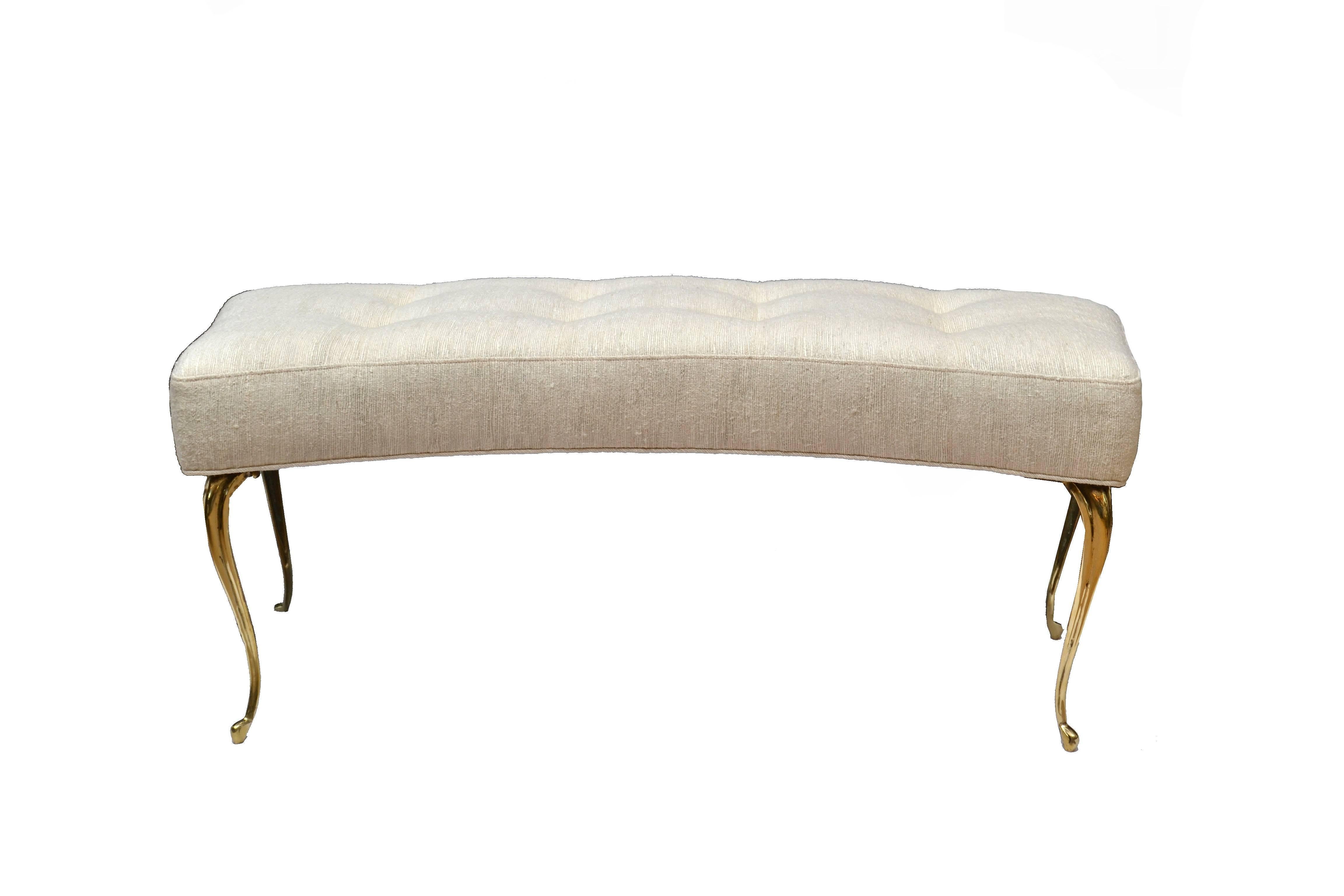 Italian curved bench in beige fabric tapered with brass legs.
This bench is newly upholstered and ready for a new home.
 