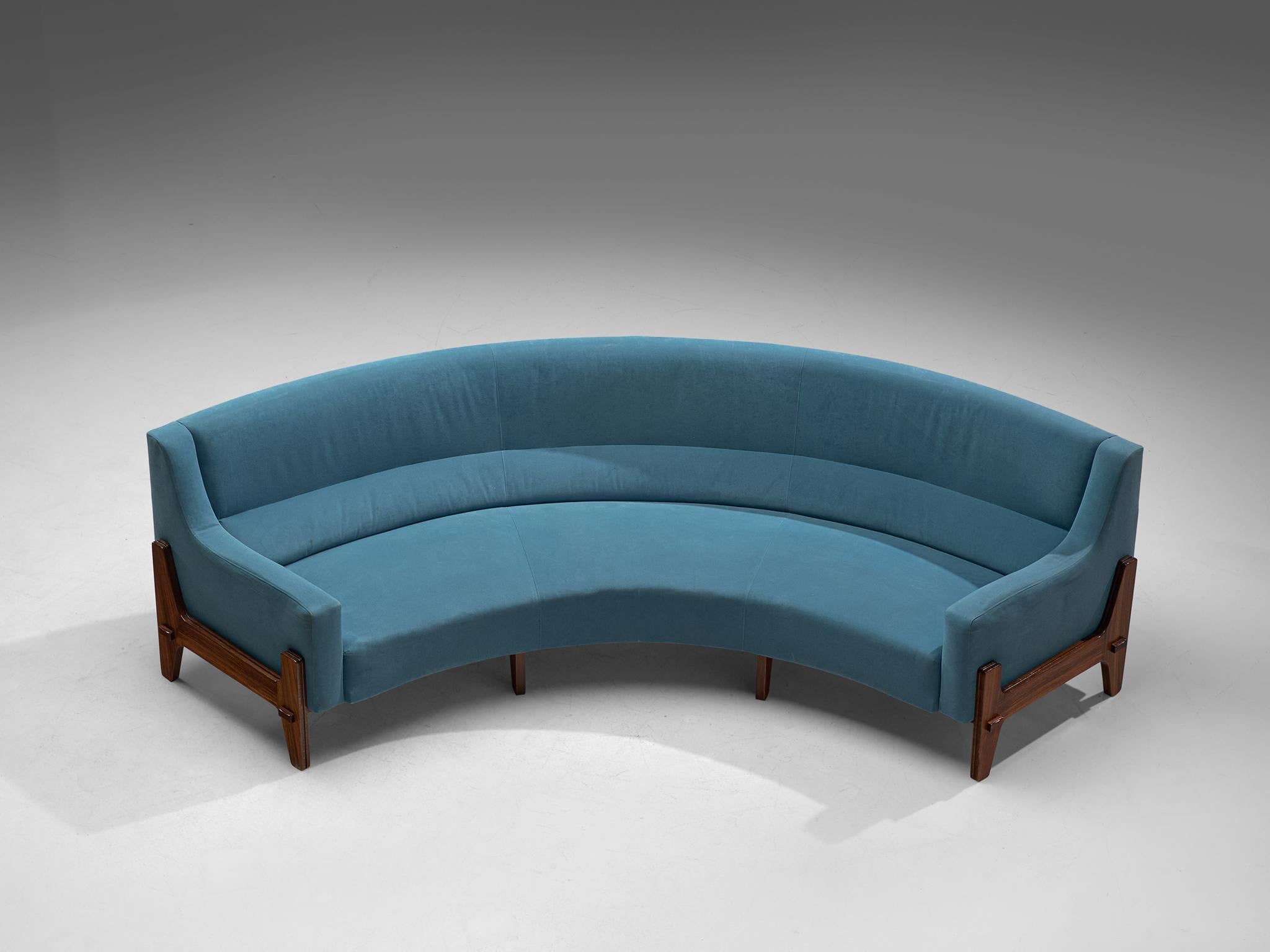 Eugenia & Luigi Reggio, curved sofa, rosewood and fabric, Italy, 1950s.

This sturdy curved sofa can a wonderful center piece in your interior. Made with a rosewood frame that is prominent in this design, and is finished with a sky blue upholstery.