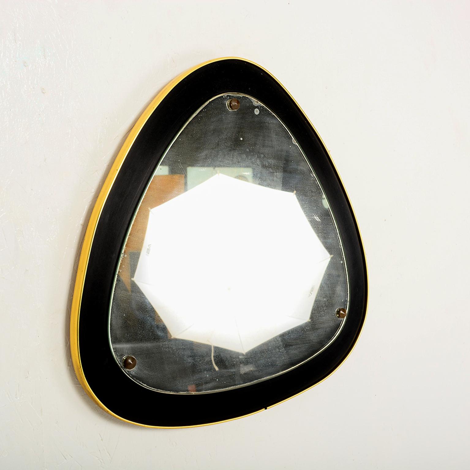 Mirror
Curvilinear Italian Wall Mirror brass & ebonized wood.
Made in Italy, midcentury modern 1950s.
Original vintage unrestored condition. Note small crack on one of the corners
See images.
Dimensions: H 22.5 in. x W 22.5 in. x D 1 in.
LA