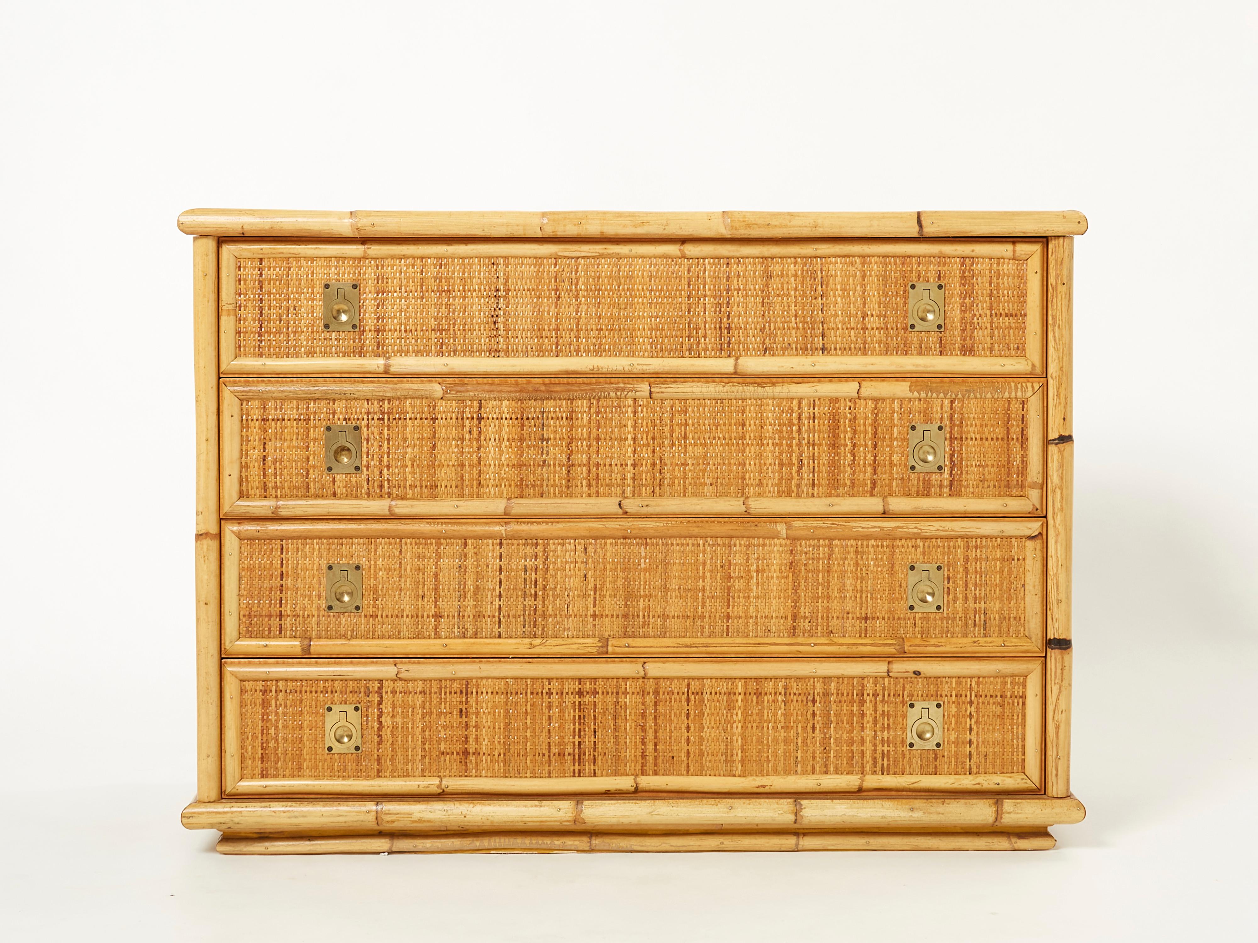 Natural bamboo as the chief material creates a summery, organic aesthetic in this 1970’s commode chest of drawers, while bright brass handles are strong, adding eye-catching touches. The brass handles on the drawers are lovely examples of