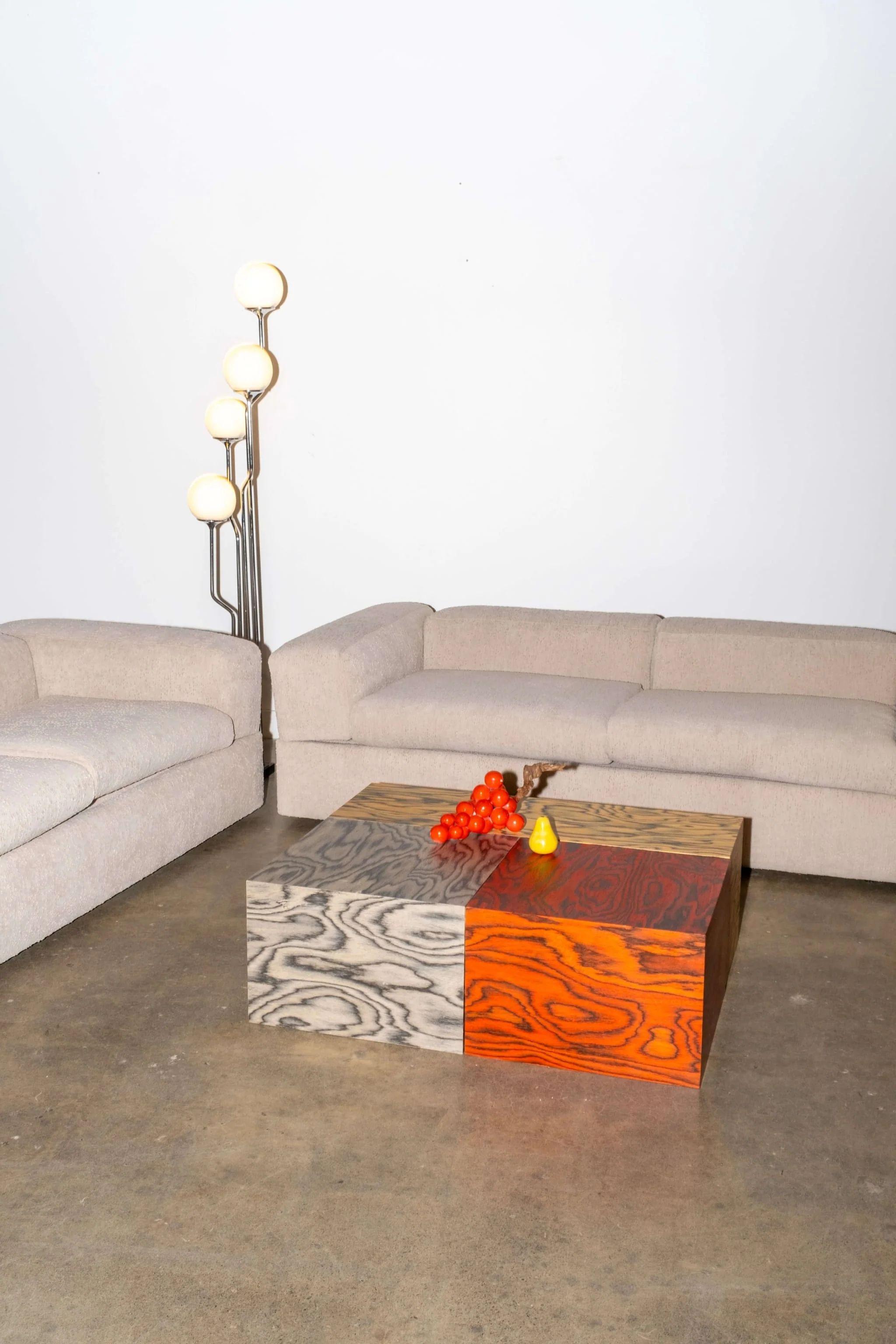 Designer Tito Agnoli's take on a sleeper sofa. Arms and back rests fold out to reveal functional bedside tables and a twin mattress. Two available. 