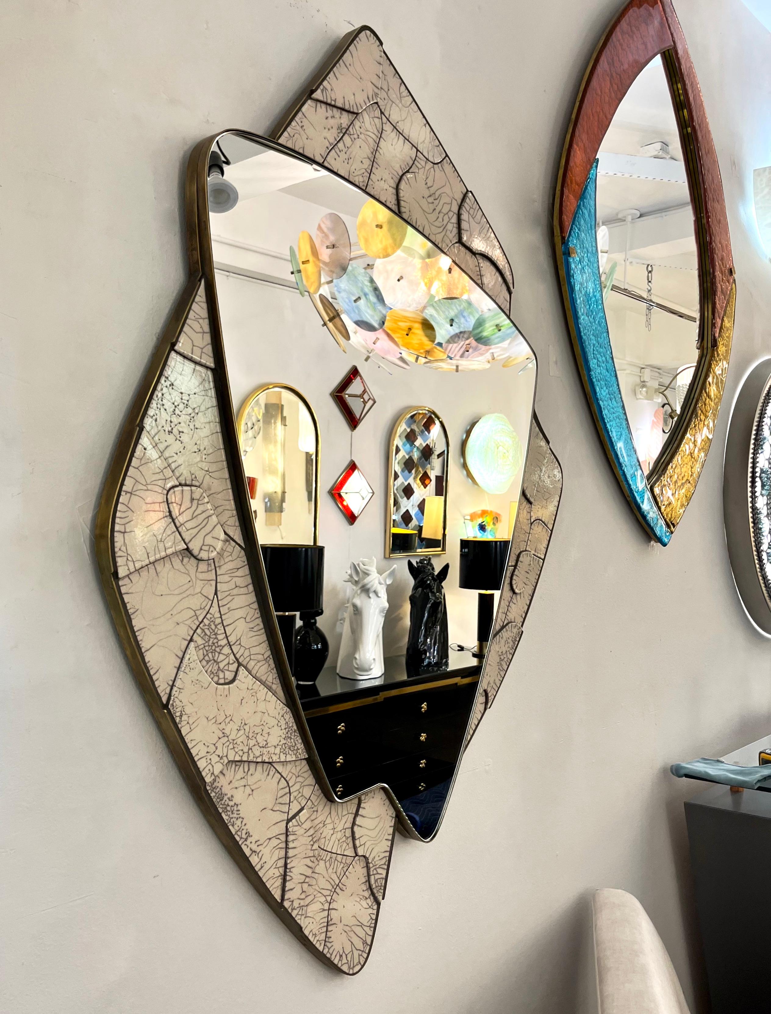 Unique Italian design mirror sculpture, organic modern Work of Art in ceramic, entirely handcrafted in Italy, worked with a deconstructed pattern in a Japanese style. Different thicknesses create steps and movement, the central mirror plate in