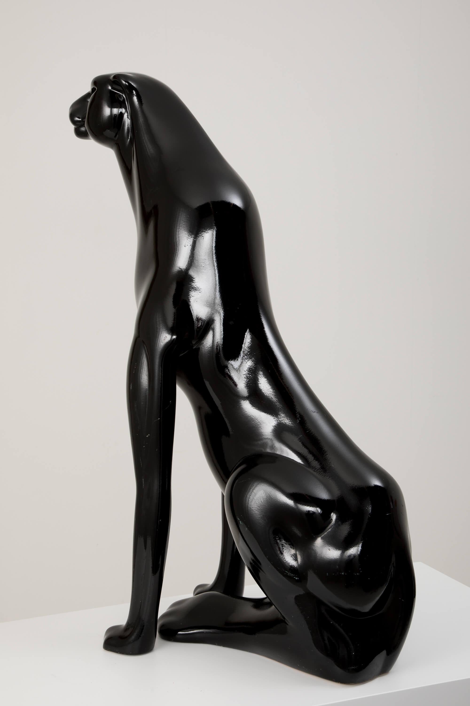 A striking example of 1980s Italian decorative art, this black panther sculpture captures dynamic movement and bold elegance in equal measure. Crafted with meticulous attention to form and surface, the panther's sleek silhouette and glossy black