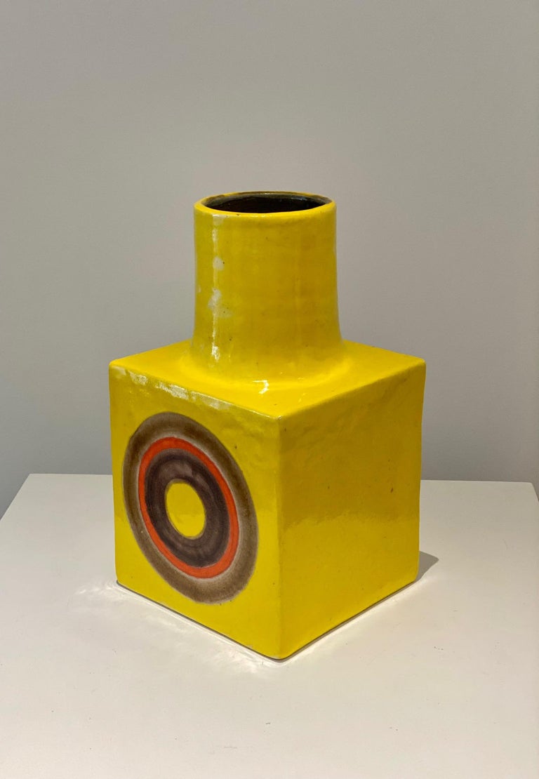 Shiny yellow enameled with orange & brown circles on both side vase by Bruno Gambone
Circa 1960s/1970s
Measures: H 25 cm x L 15 cm
Artist-signed Gambone Italy at base.

