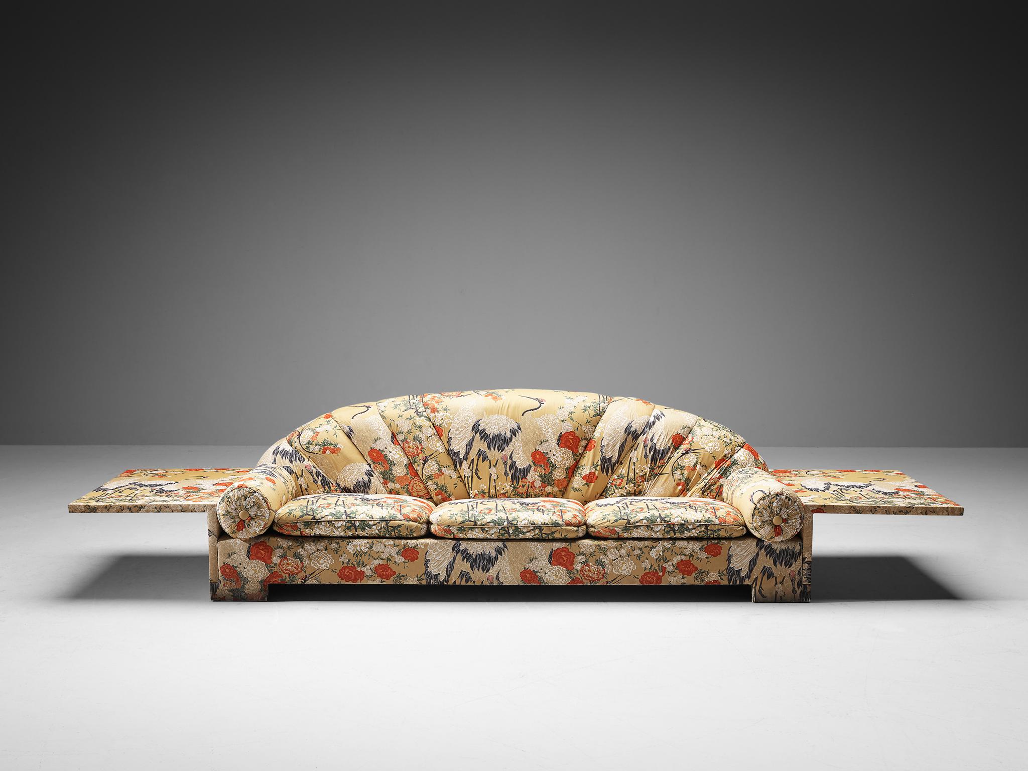 Sofa, fabric, Italy, 1980s.

A graceful sofa that has an unconventional construction based on voluminous forms and pronounced lines. This piece is defined by its geometric layout as the back embodies a semi-circular shape and the seat and side