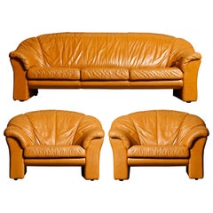 Italian Deep Seated Cognac Leather Sofa and Lounge Chairs, circa 1970s