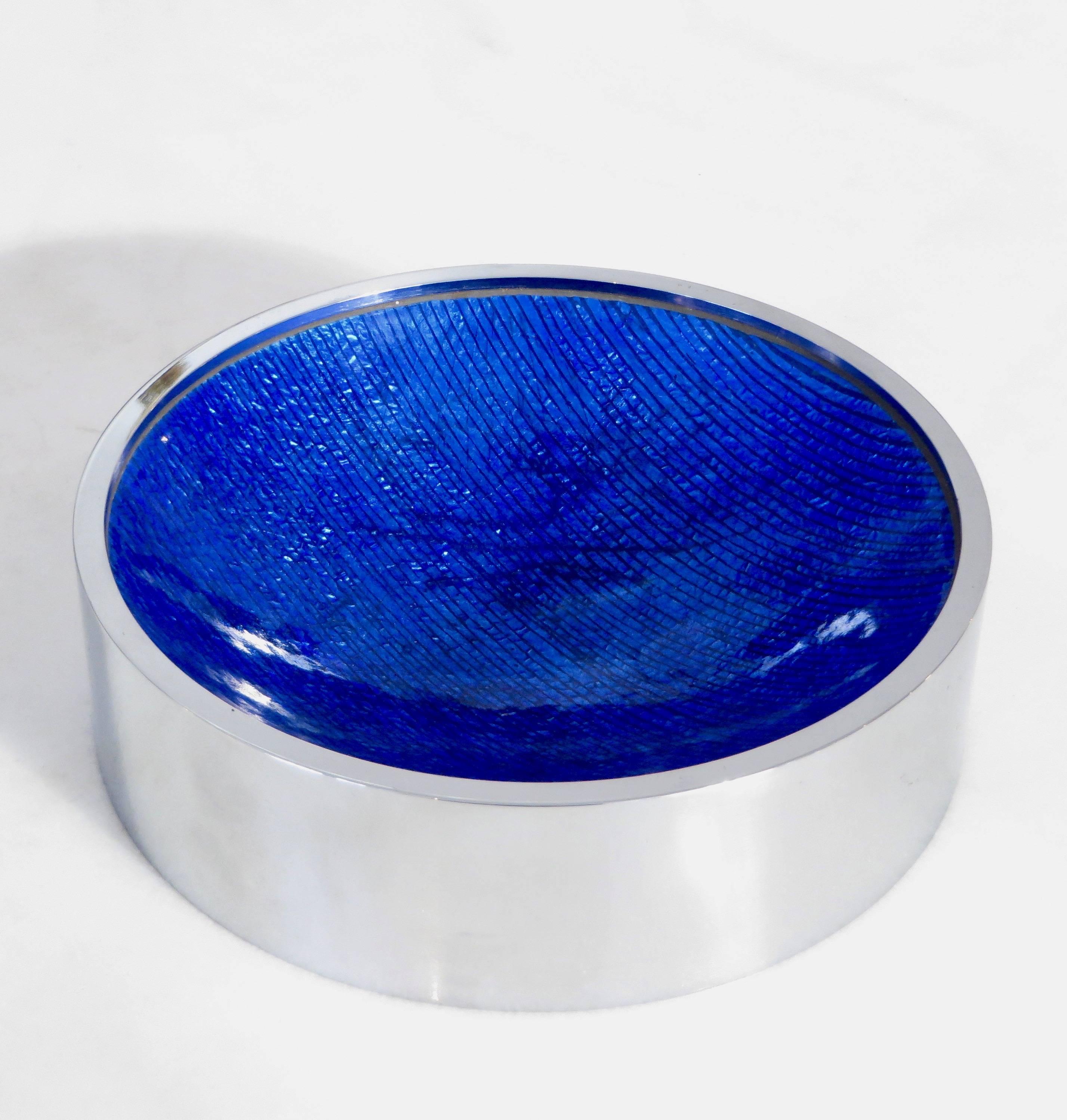 Italian Del Campo blue enameled vide poche or dish or candy dish with a nickel chrome frame.
A deep blue with subtle lines of black enamel dish in perfect condition.
A fine desk accessory.
 
