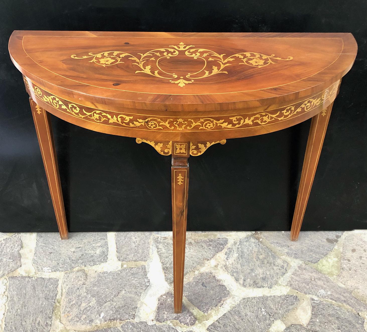 Italian half moon console table from 1940 with fruit and walnut wood inlays. 
The support is in spruce and poplar.
 The article is an example built in 1940 on the style of a piece of furniture from the 1800s.
 It has no obvious defects.The paint