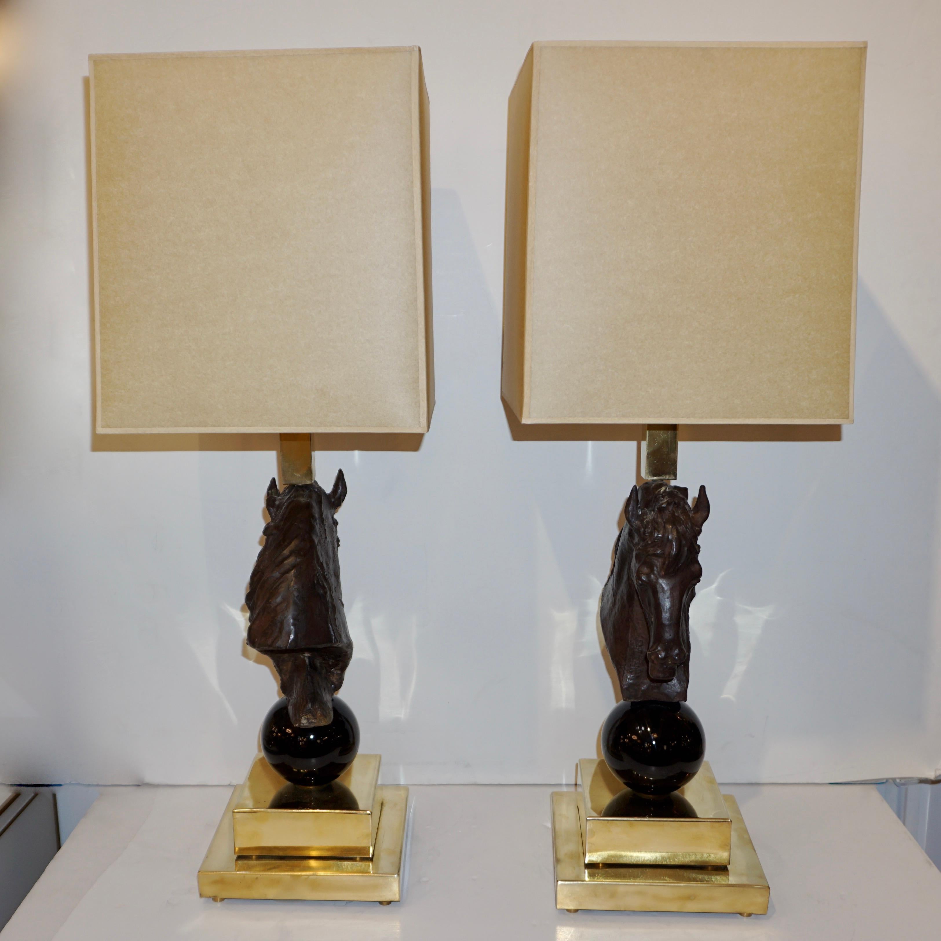 Italian design 1990s brass lamps, elegant and sculptural for Hollywood Regency interiors. A piece of art bronze sculpture of a horse head, with intricate detailing in the horse mane and facial expression, brings these lamps to life. The animal head