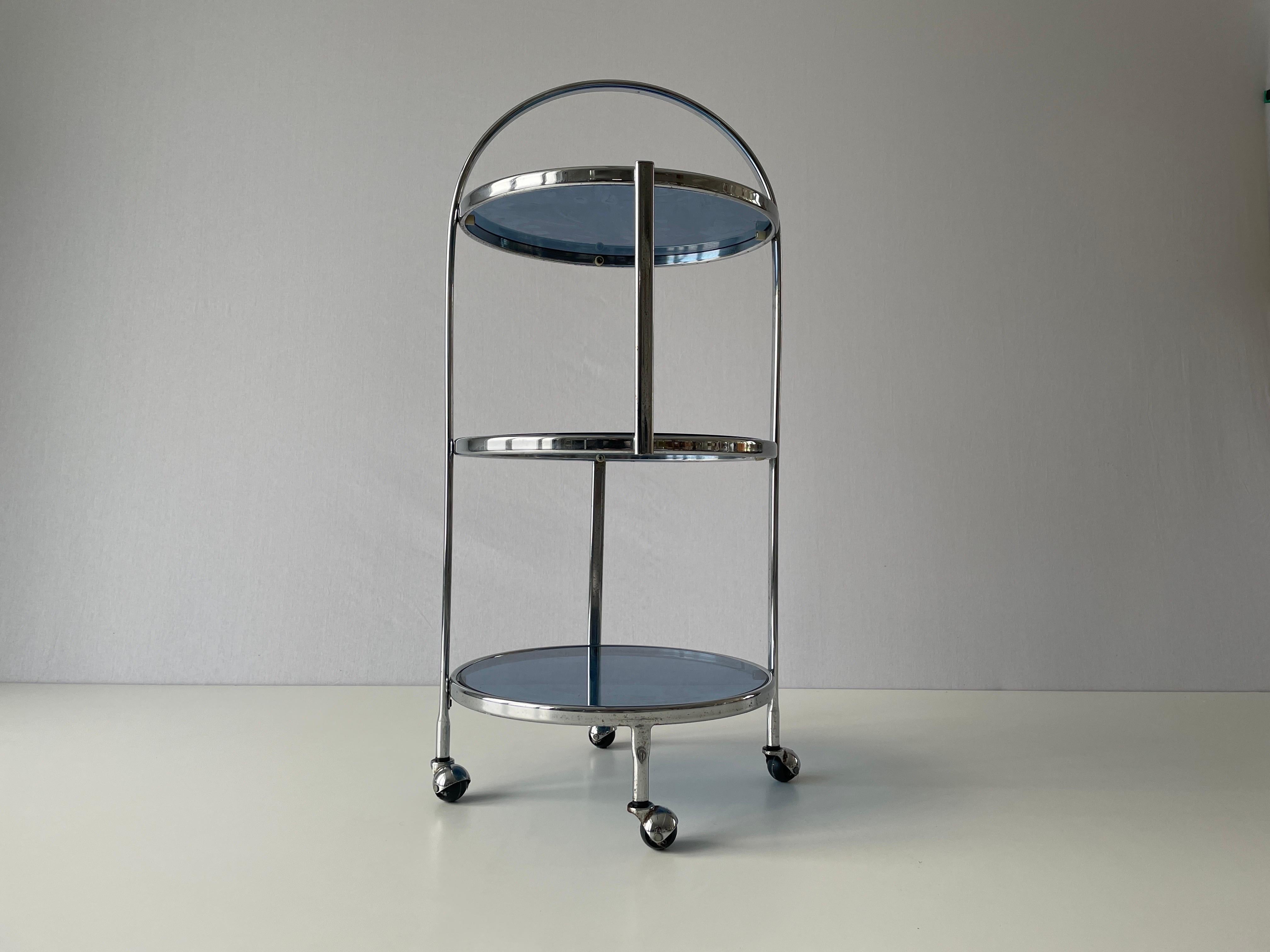 Italian Design 3-layer Chrome and Blue Glass Trolley, 1960s, Italy

Measurtements :

Height: 86 cm
Diameter: 39 cm
Shelf heights from bottom to top: 15cm , 42 cm and 70 cm

Please do not hesitate to ask us if you have any questions.