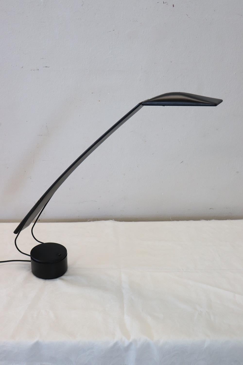 Italian Design adjustable table or desk lamp. PAF studio (Milan) Dove model lamp by Mario Barbaglia and Marco Colombo, 1980s. Plastic structure with metal supports, height adjustable, on swivel base. Halogen lamp with switch on the base.
In