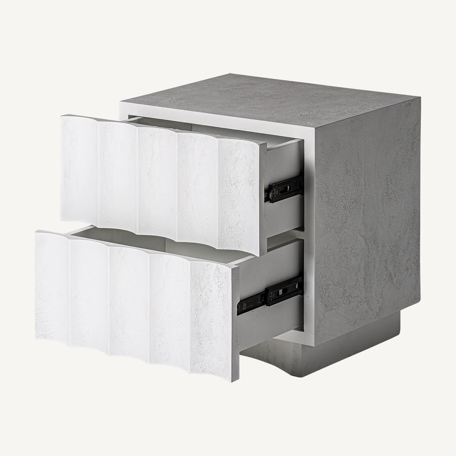 Graphic and Italian design with brutalist style bedside table in white concrete stone finishes.