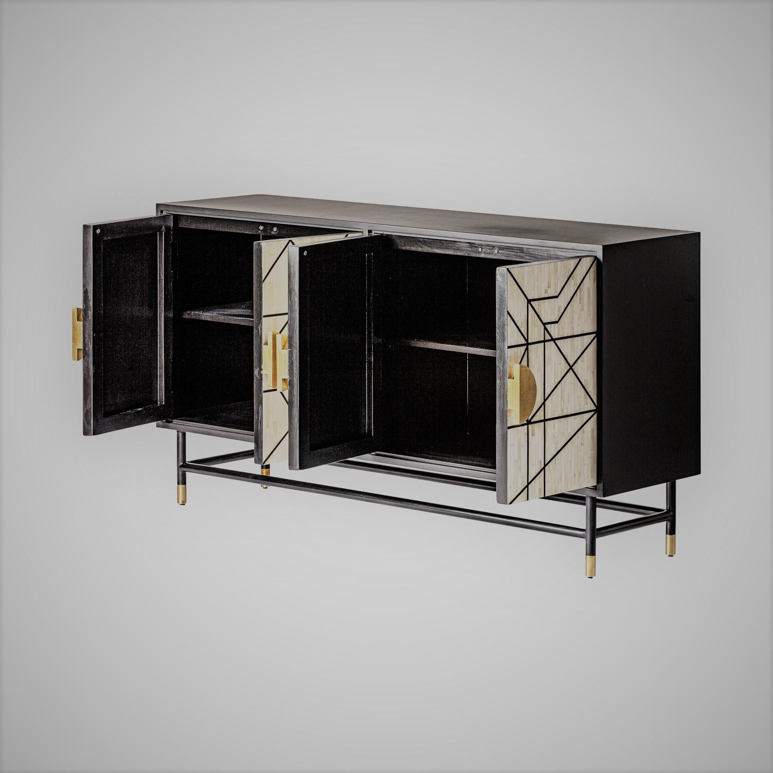Italian Design and Memphis style black and white sideboard composed of black lacquered iron base, black lacquered wooden, graphic door panels opening on shelves, and brass finishes.