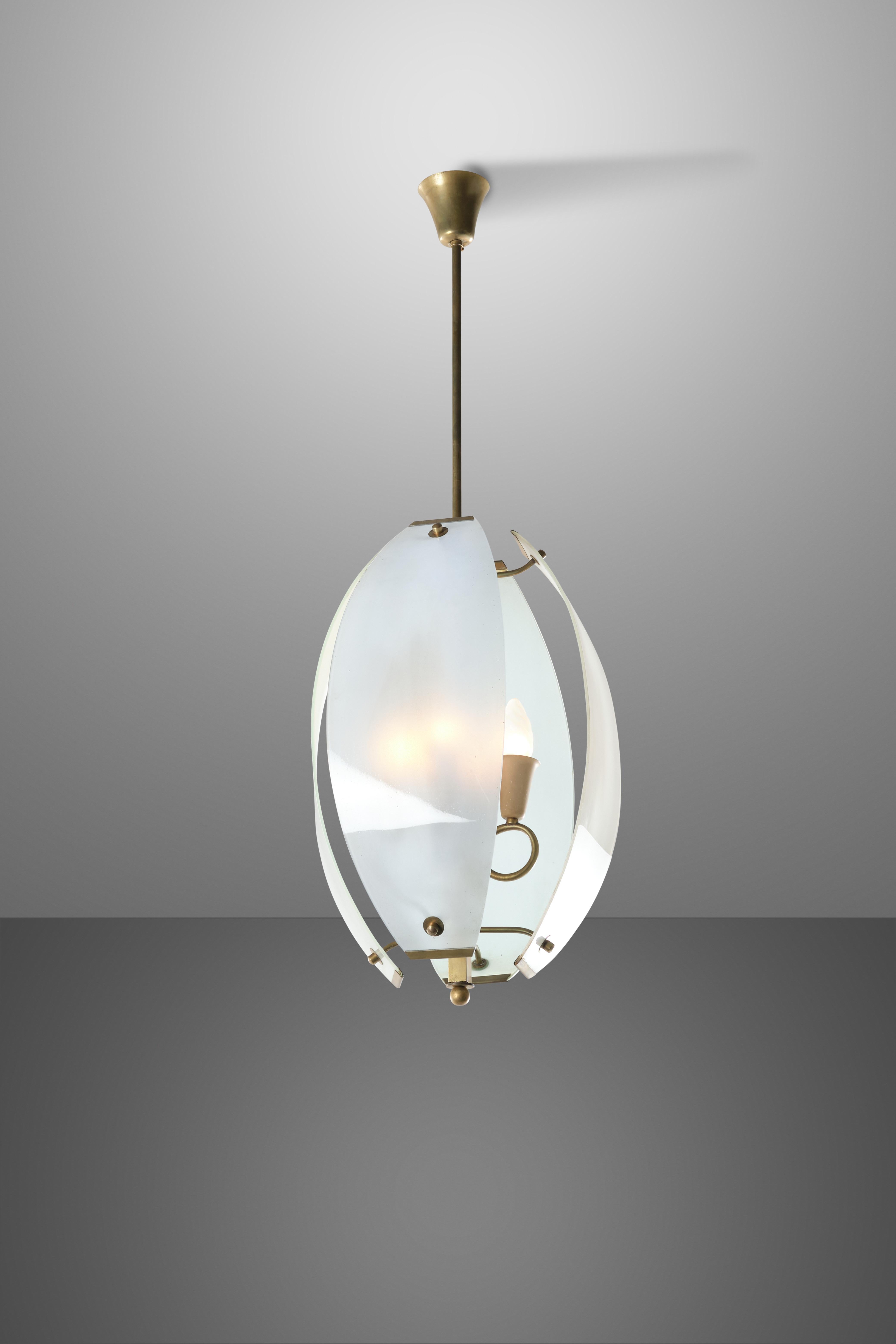 Light and delicate, this mid-century chandelier seems to use the curved screens of frosted crystal as propellers to hang in the air and provide light to the room without apparently being connected to anything. The interplay of direct and