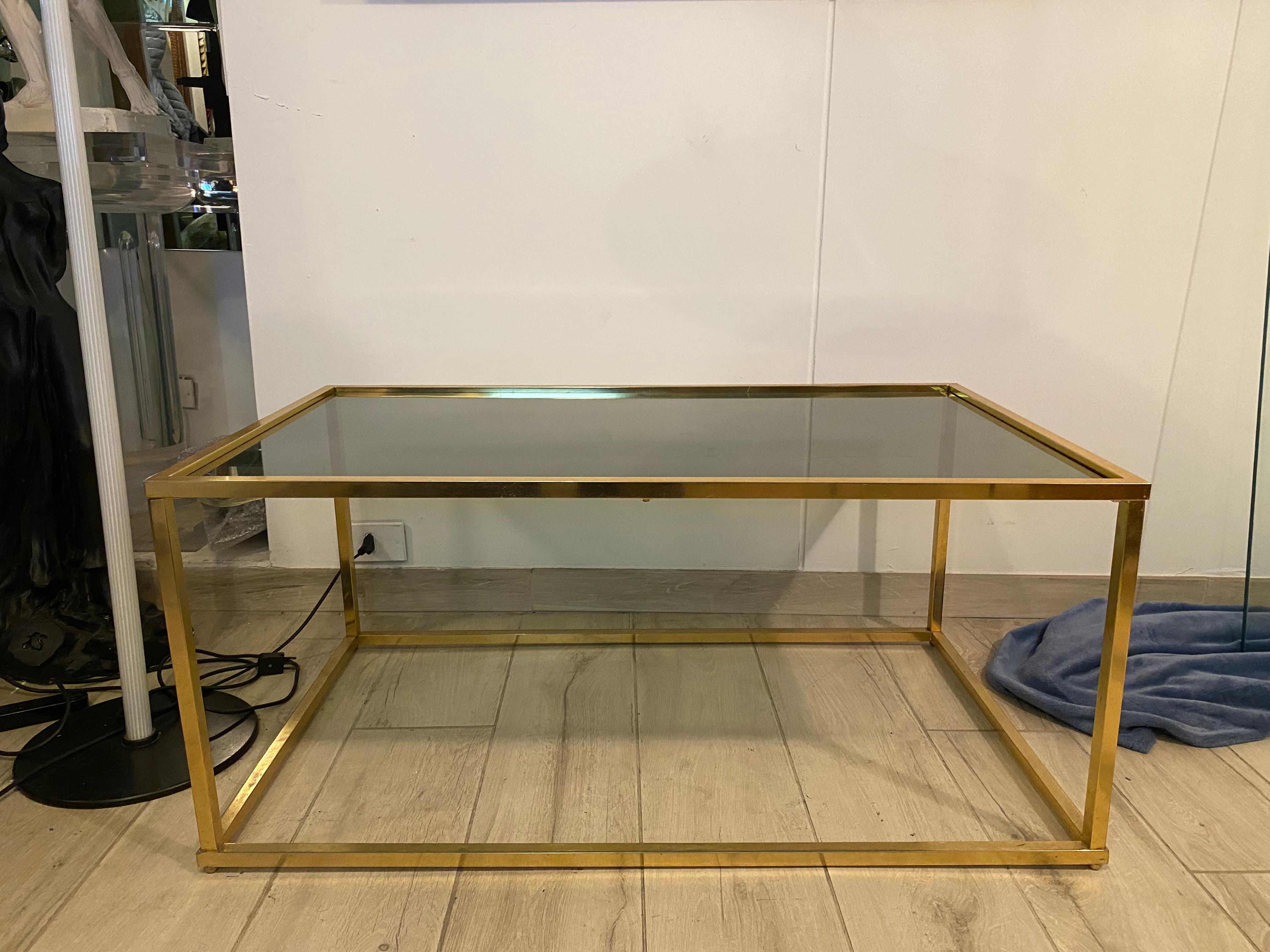 Beautiful 70s brass coffee table. Italian handcrafted product. 
Really beautiful. Green crystal. Good condition, perfectly intact. It bears some signs of time.