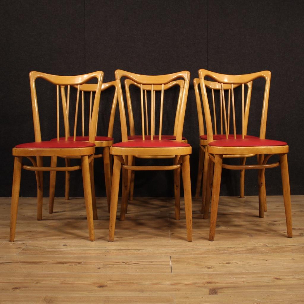 Group of Italian design chairs from the 1960s-1970s. Furniture in exotic wood with seats covered in imitation leather. Six chairs of good solidity with faux leather upholstery showing defects (see photo) to be replaced. Furniture for antiquarians