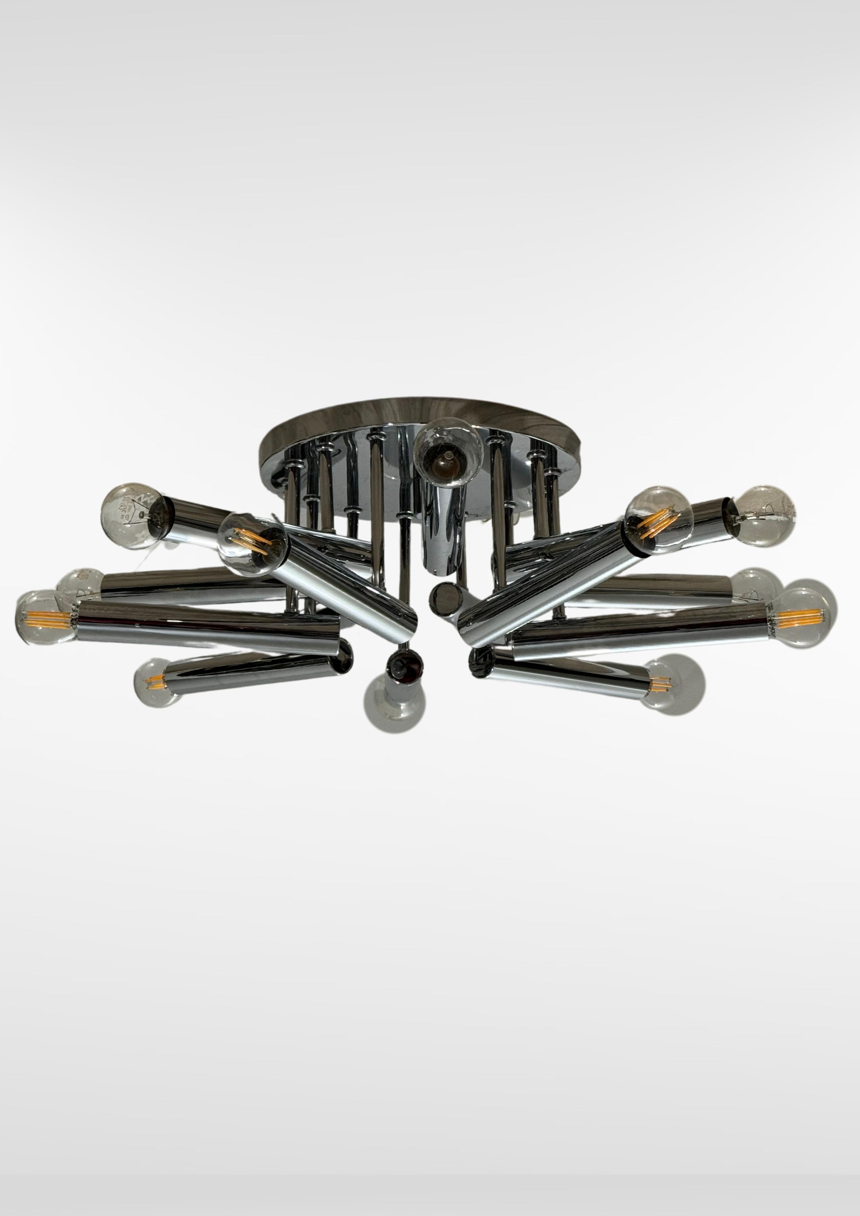 Stunning mid-century chrome plafond lamp by Gaetano Sciolari for S A Boulanger, circa 1970.
Large sized chromed steel Sputnik ceiling lamp with 14 light points.
Can be wall or ceiling mounted.
Recently rewired to  modern safety standards.
Uses 14
