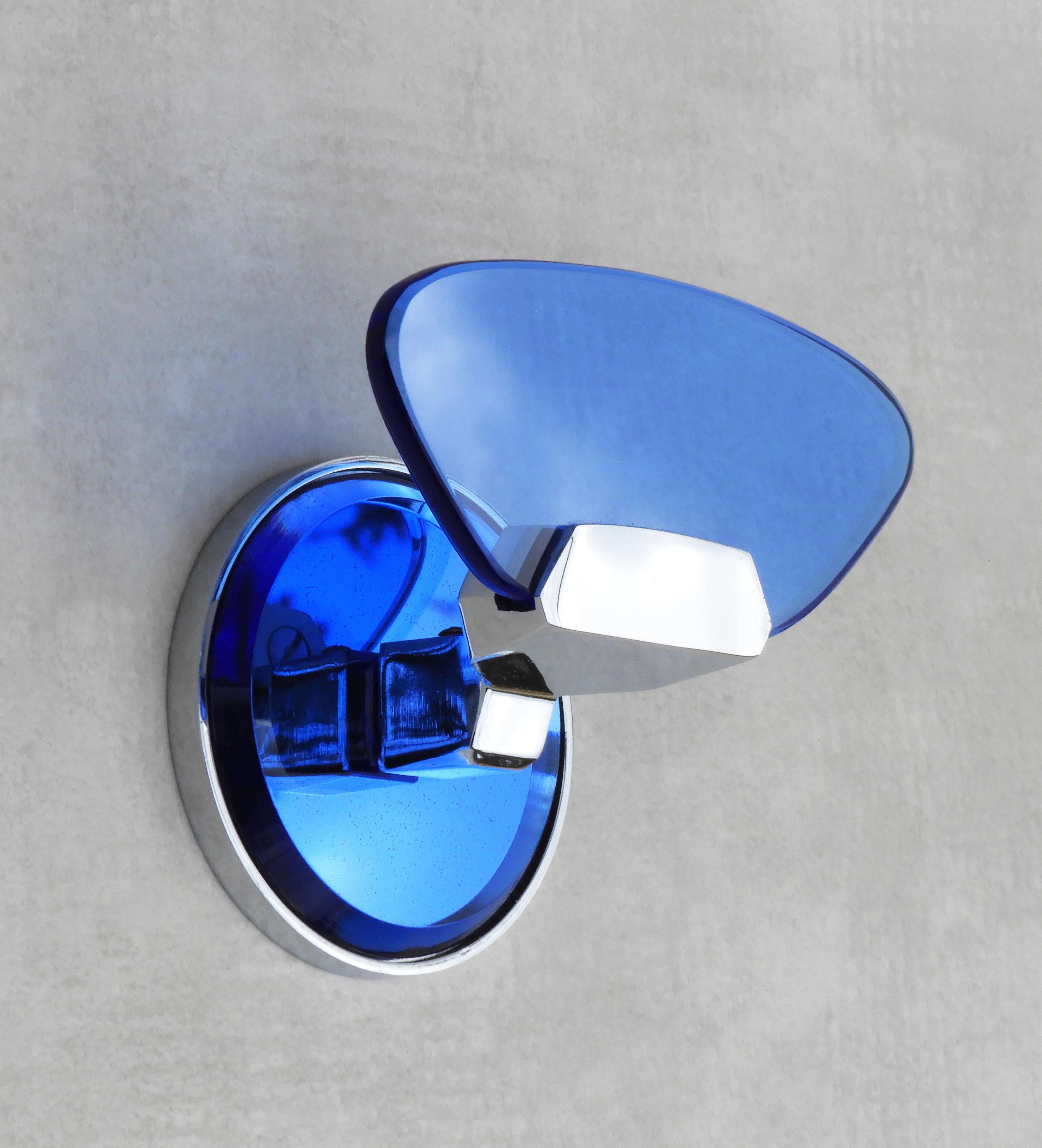 Italian design coat hooks from Veca C1970.   Attractive blue glass on a chromed frame with a mirrored back plate. Part of a selection of accessories and wall lights available in the same style  - please see our other listings. 
In good vintage