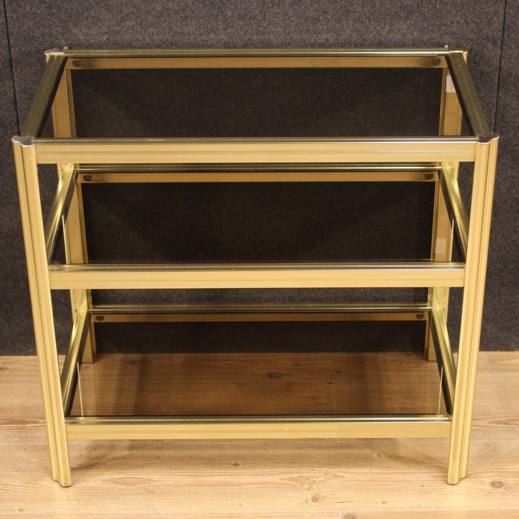 Italian design coffee table from the 1980s. Metal cabinet gold equipped with three opaque glass shelves of beautiful line and good service. Coffee table of good size and pleasant furnishings that can be easily inserted in different parts of the