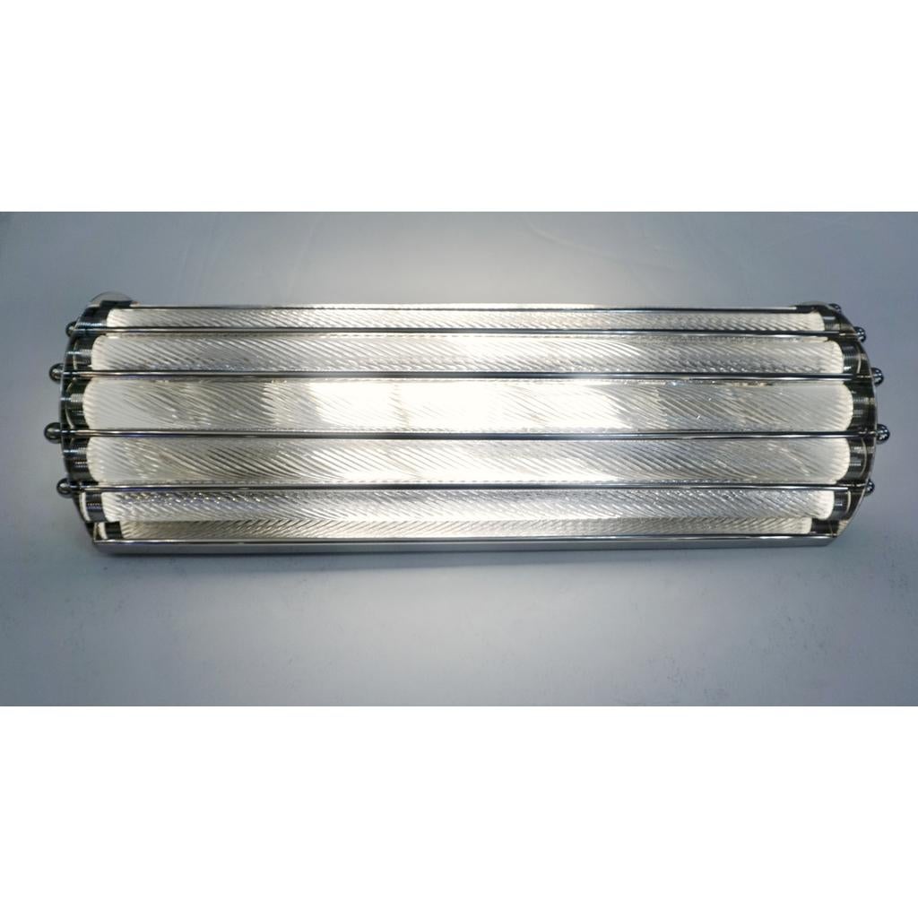 Contemporary customizable Italian Art Deco Design semi-circular flushmount, entirely handcrafted, with a polished nickel finish. The nicely scalloped airy structure supports crystal clear Murano glass rods worked with the sophisticated technique