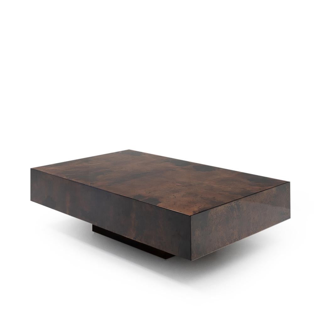 Coffee table designed by Aldo Tura during the 1970s; the table has been covered in red-brown dyed goatskin and finished with a high gloss lacquer.

The use of goatskin in furniture is a signature element of Aldo Tura’s designs, it provides a very