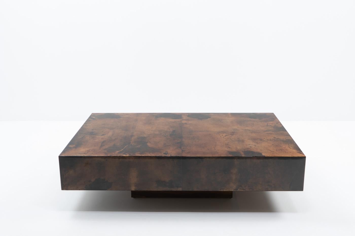 Coffee table designed by Aldo Tura during the 1970s; the table has been covered in red-brown dyed goatskin and finished with a high gloss lacquer. A beautiful statement piece, guaranteed to ignite conversation.

The use of goatskin in furniture is a