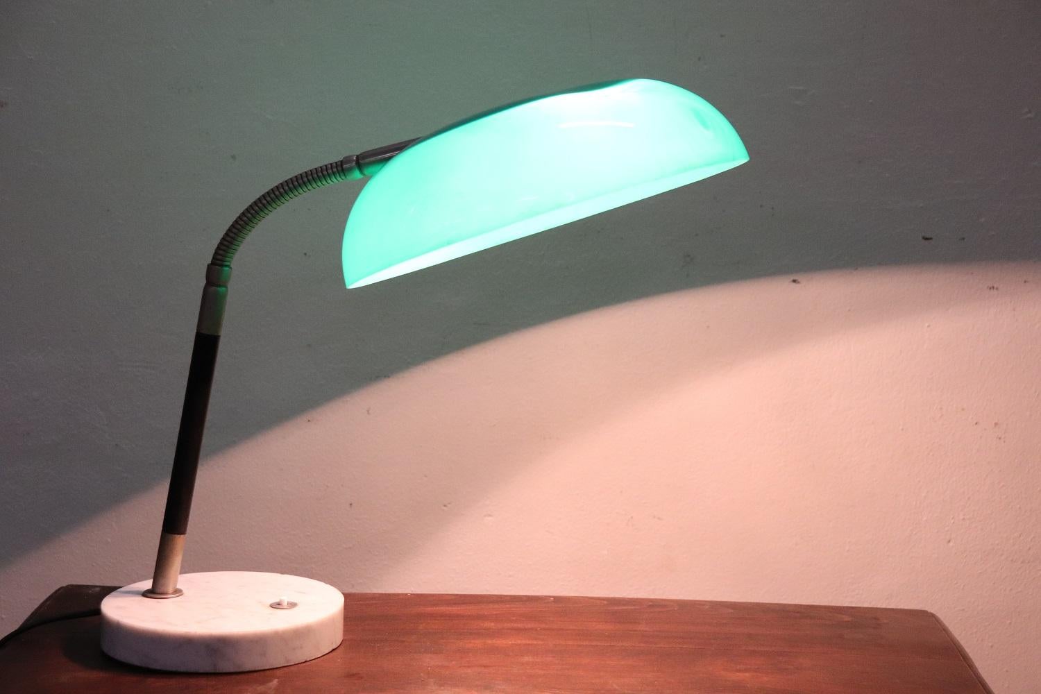 Adjustable table or desk lamp designed and produced by Stilux, Milan 1960s. White marble base, painted brass structure with green perspex shade. Twoo internal lights. Used good conditions, some signs of wear in the shade please see photos. Perfectly