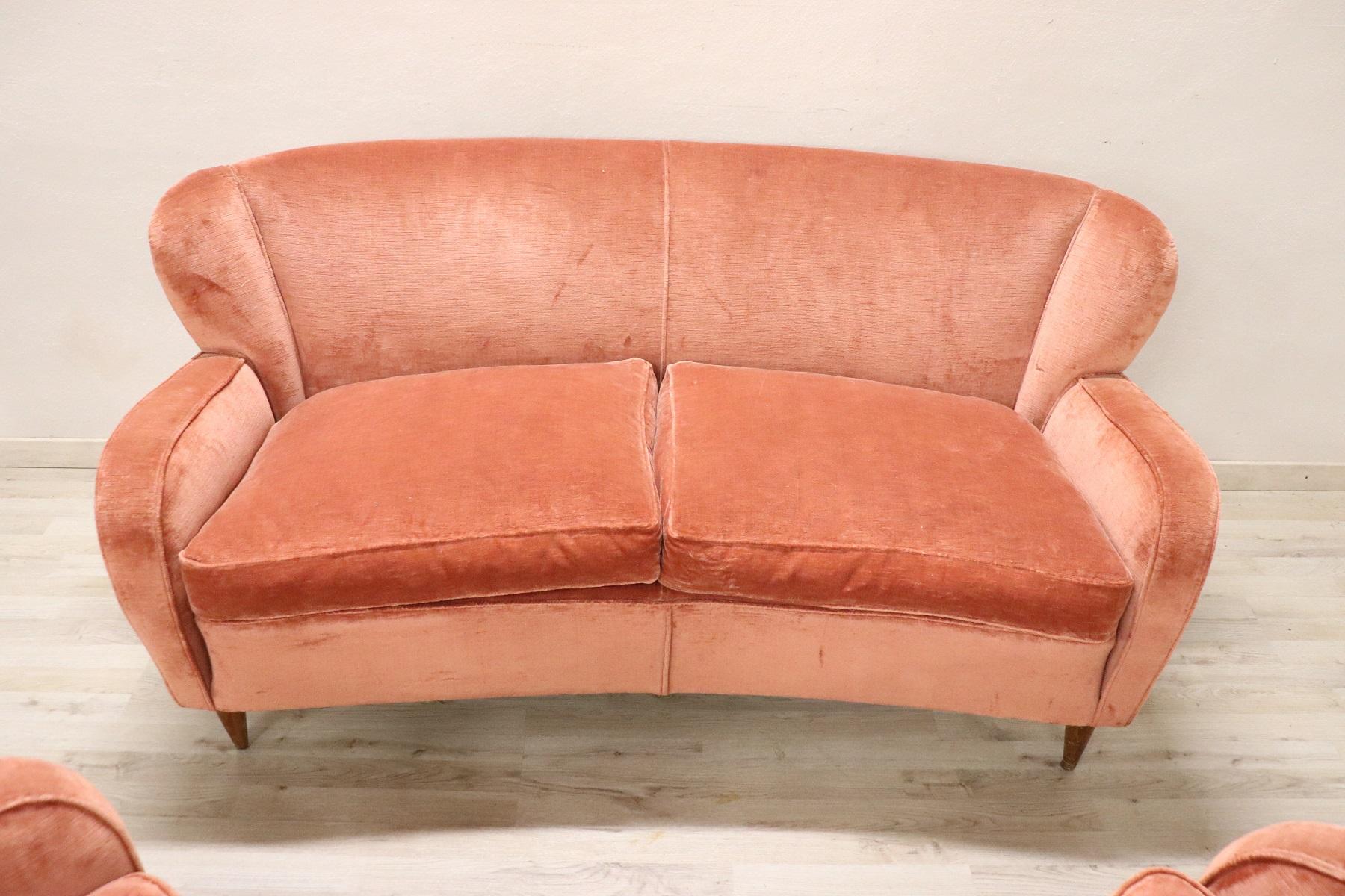 Rare complete Italian design 1970s living room set includes:
1 sofa
2 armchairs
Refined living room set in pink velvet with cushions filled with fine goose down. The living room comes from an important Italian villa and embellished the room for
