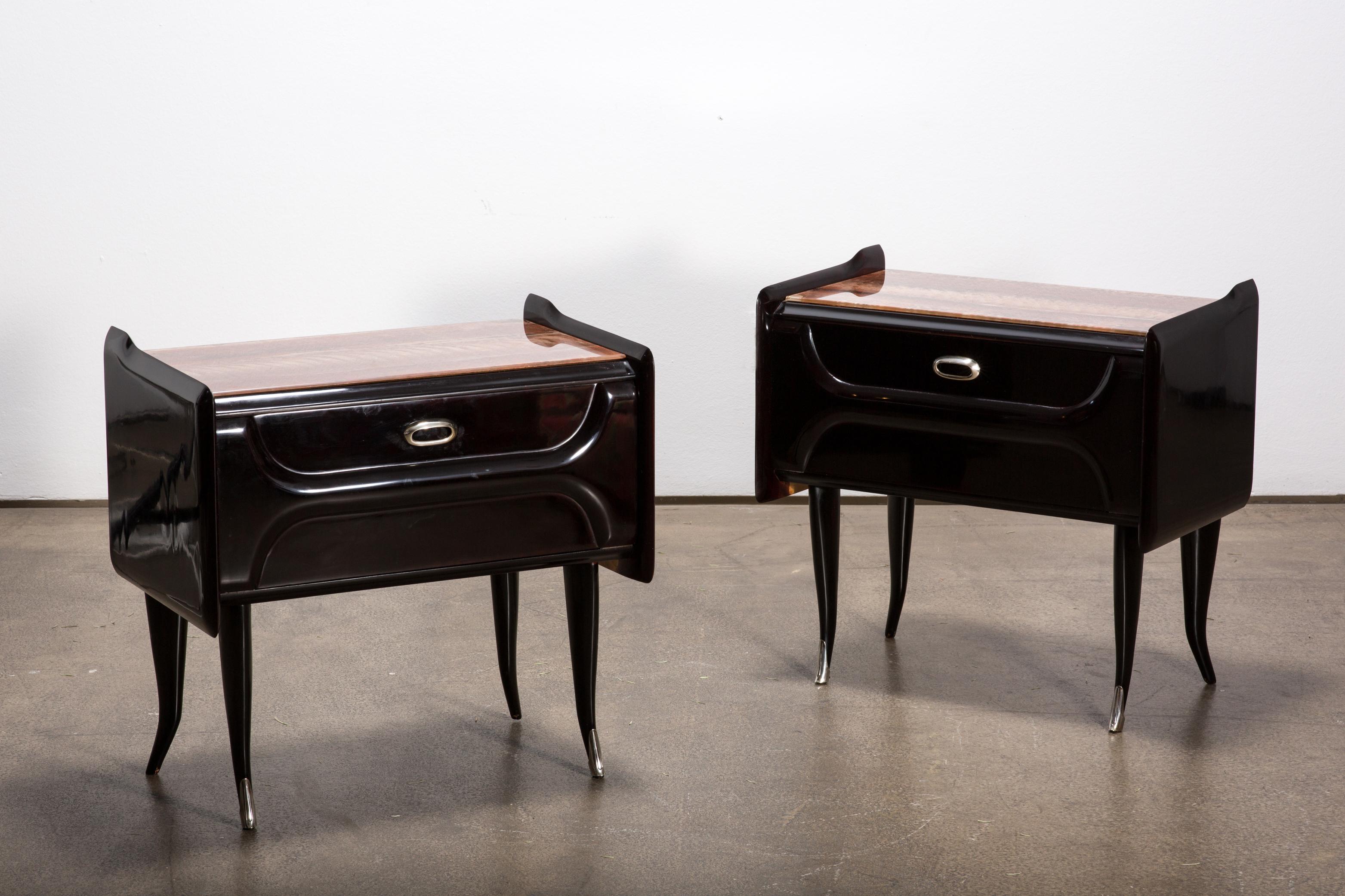 This two elegant midcentury nightstands were manufacured in Italy. 

The imposing structure combined with the exterior and the mahogany interior makes this a very beautiful piece of art. The skillfully crafted nightstands are made of an ebonized