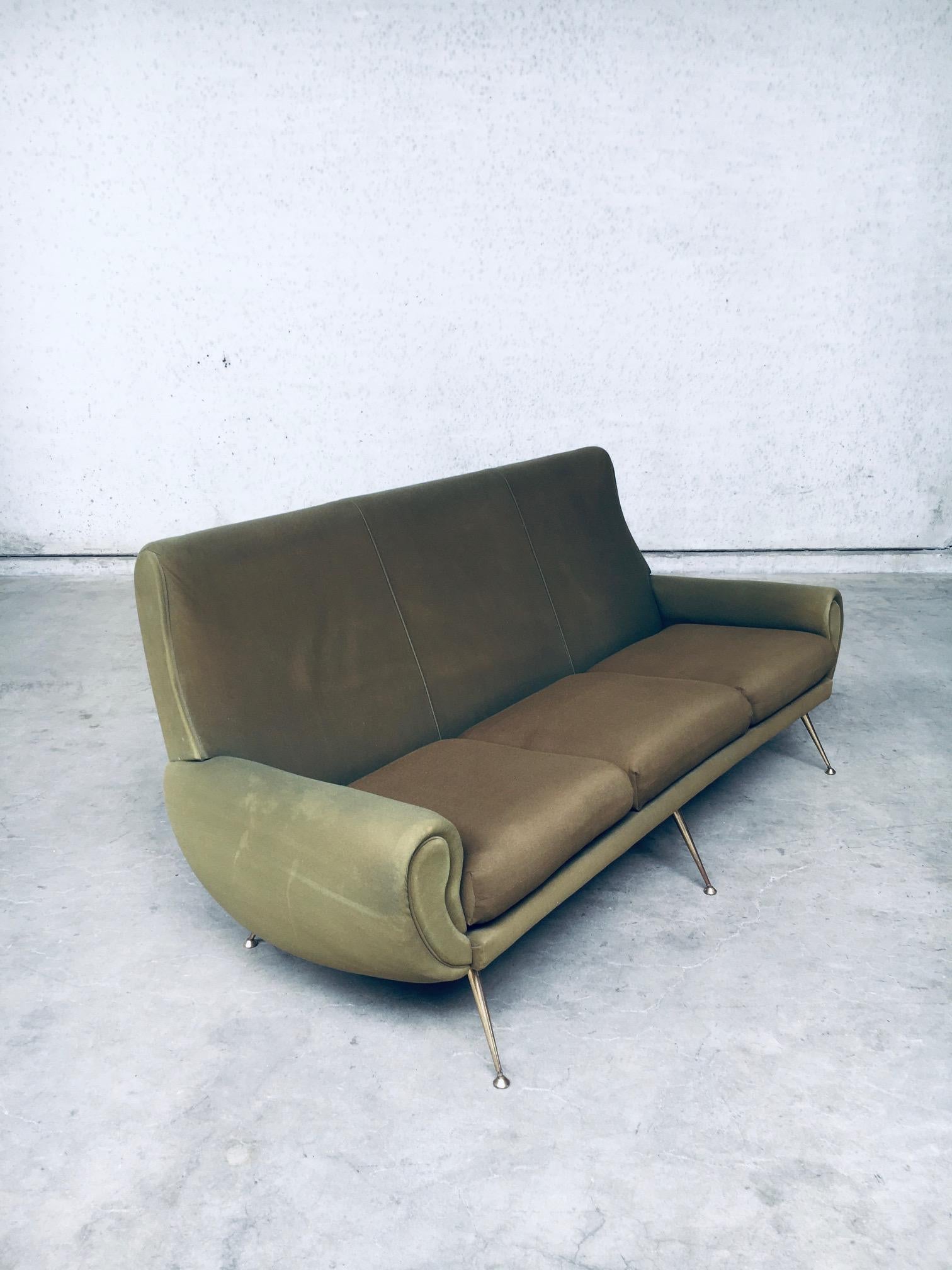 Vintage Mid-Century Modern Italian Design 3 seat sofa by Gigi Radice for Minotti, made in Italy 1950's. Soft fabric in kaki green on this well formed 3 seater sofa with brass feet. The 3 seating cushions have been reupholstered with modern fabric in