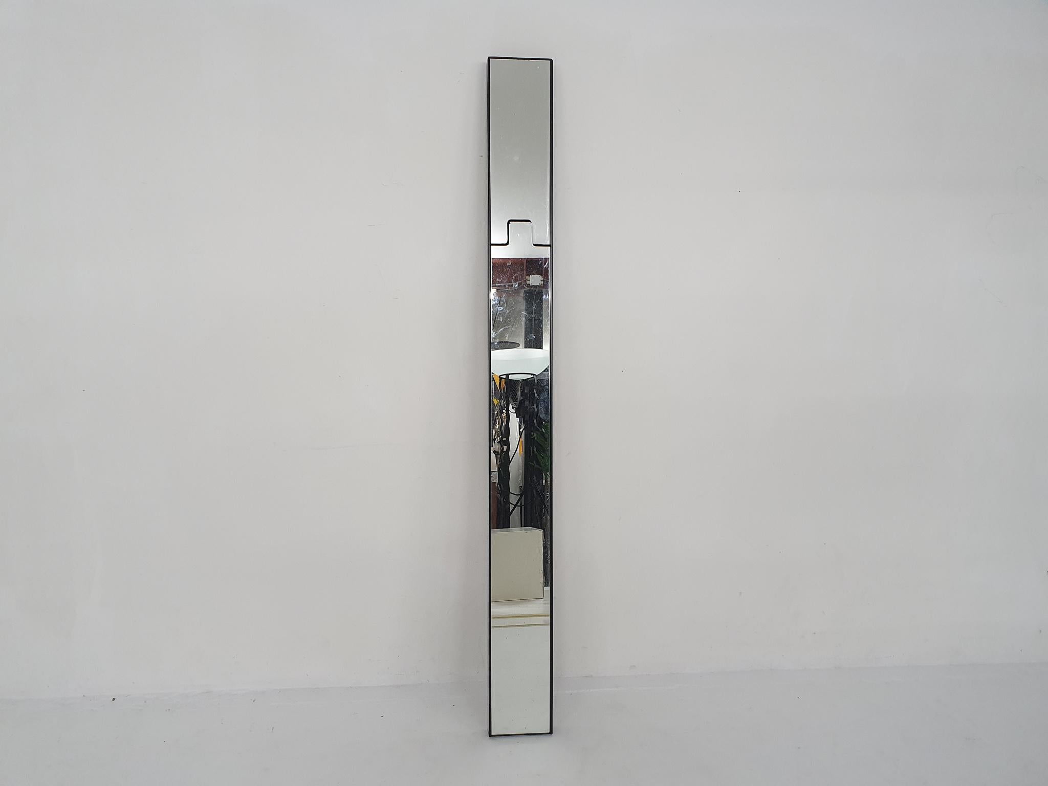 Black plastic mirror by Luciano Bertoncini. The upper part can be pushed back a little to create a coat hanger.
There is a small chip from the mirror. The plastic part is in good condition.