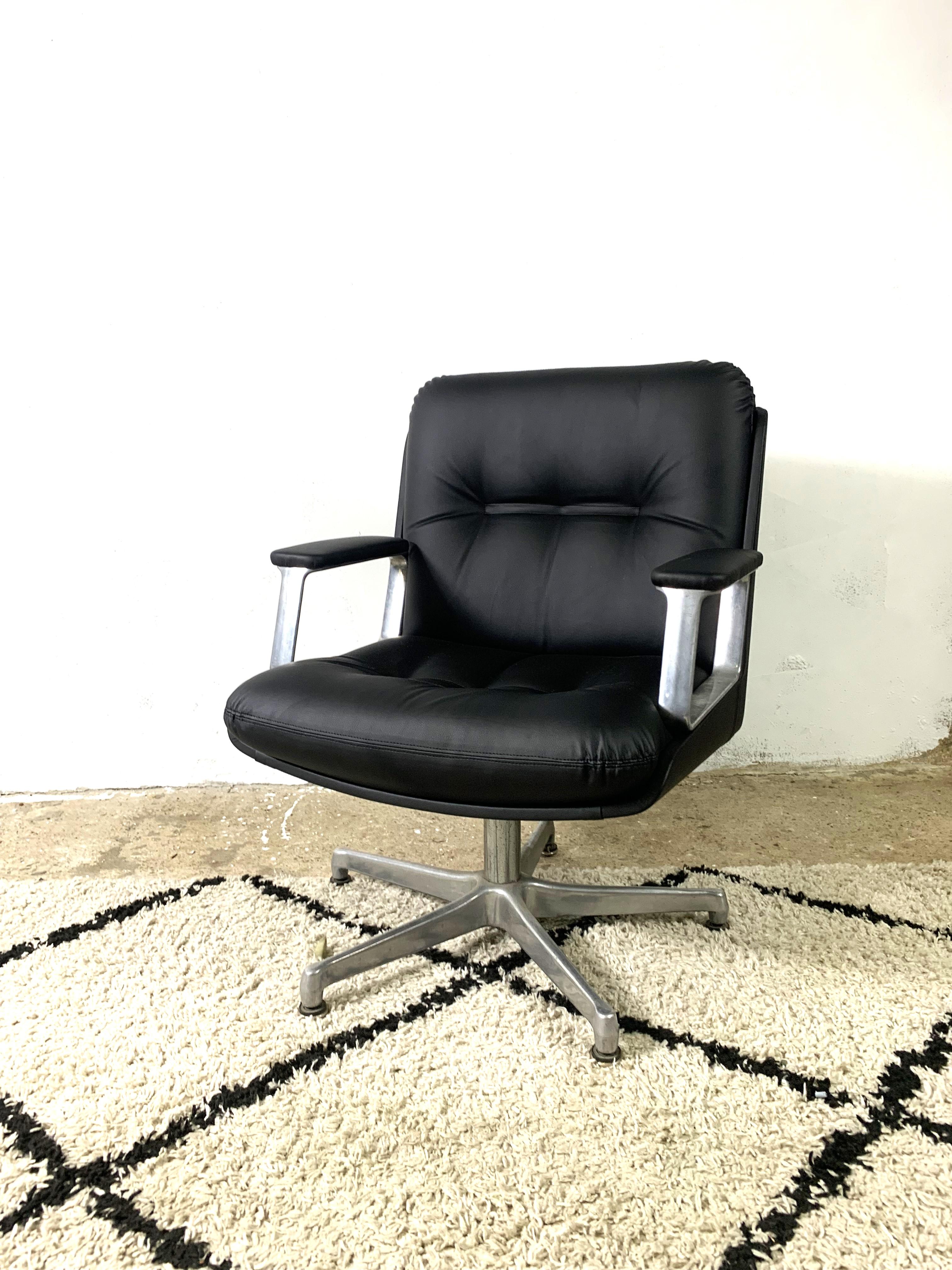 Executive Office Chair made by Vaghi 1960s. The chair has very broad armrests and an aluminum frame . Reupholstered with black leatherette. Beautiful chair in excellent condition.