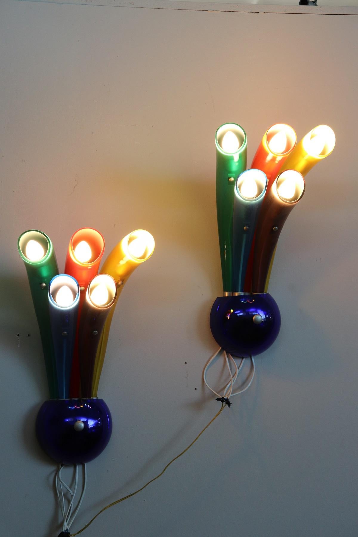 Beautiful and refined pair of Murano Italian design sconces from the 1980s in coloured glass. Beautiful colors yellow, red, blue green and purple. Total five bulbs. Perfect condition and fully functional.