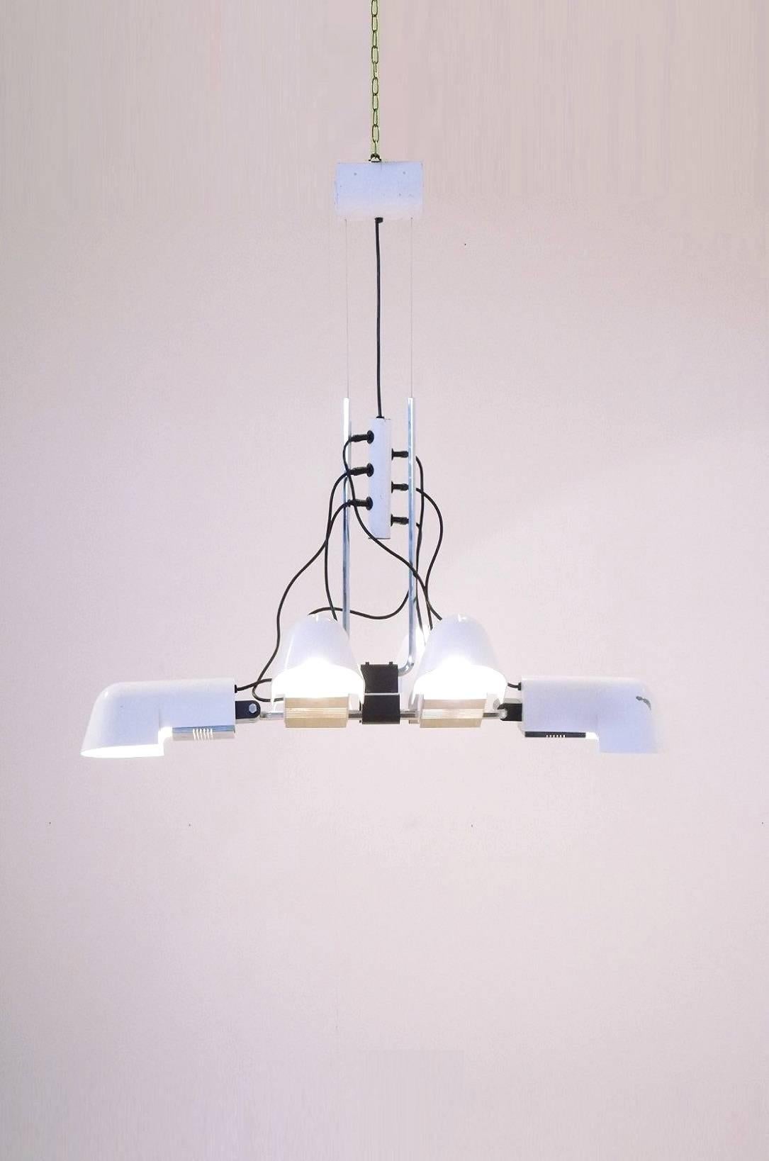 1970s large chandelier, model Pala, was designed by Danilo and Corrado Aroldi and manufactured by Luci. It is made from white lacquered cast aluminum, chromed metal, and black plastic. This lamp is composed of six shades that can be taken apart and