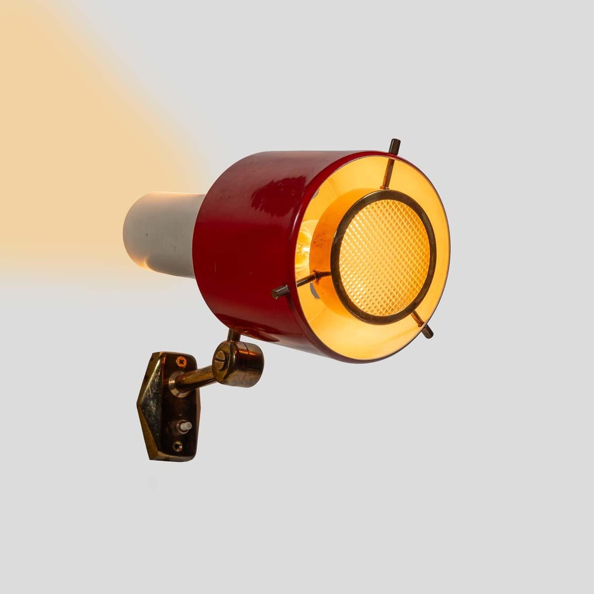 Red and White Stilnovo Wall Light, 1950s

An iconic example of Italian mid-century design, this 1950s wall light by Stilnovo features a distinctive red and white lacquered metal shade. Designed with both form and function in mind, the fixture offers