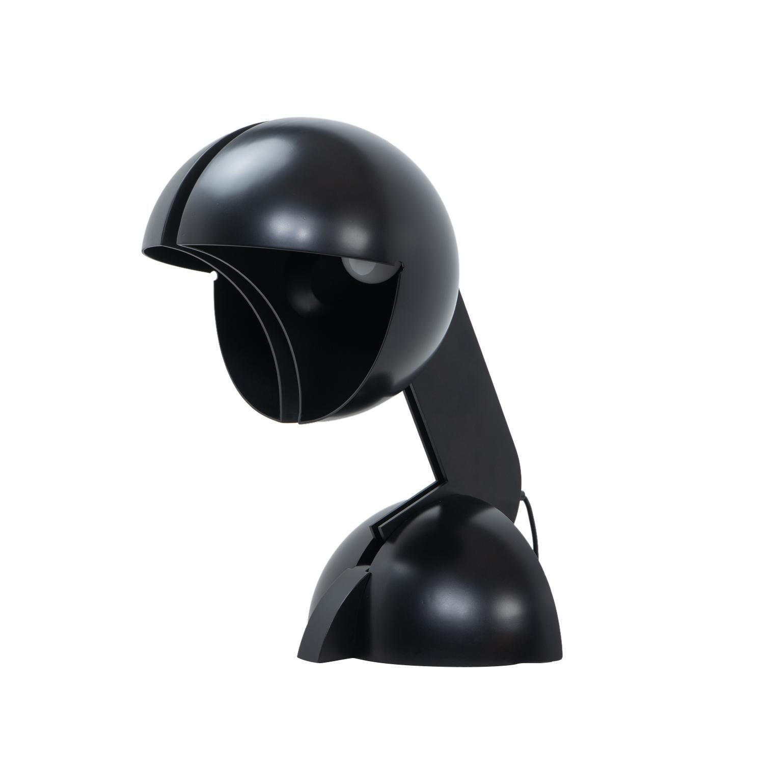 Designed by Italian architect Gae Aulenti in 1968 for Martinelli Luce, the Ruspa table lamp reflects her sculptural and functional approach to lighting. Made from lacquered metal, the lamp features a swiveling, adjustable shade that allows for