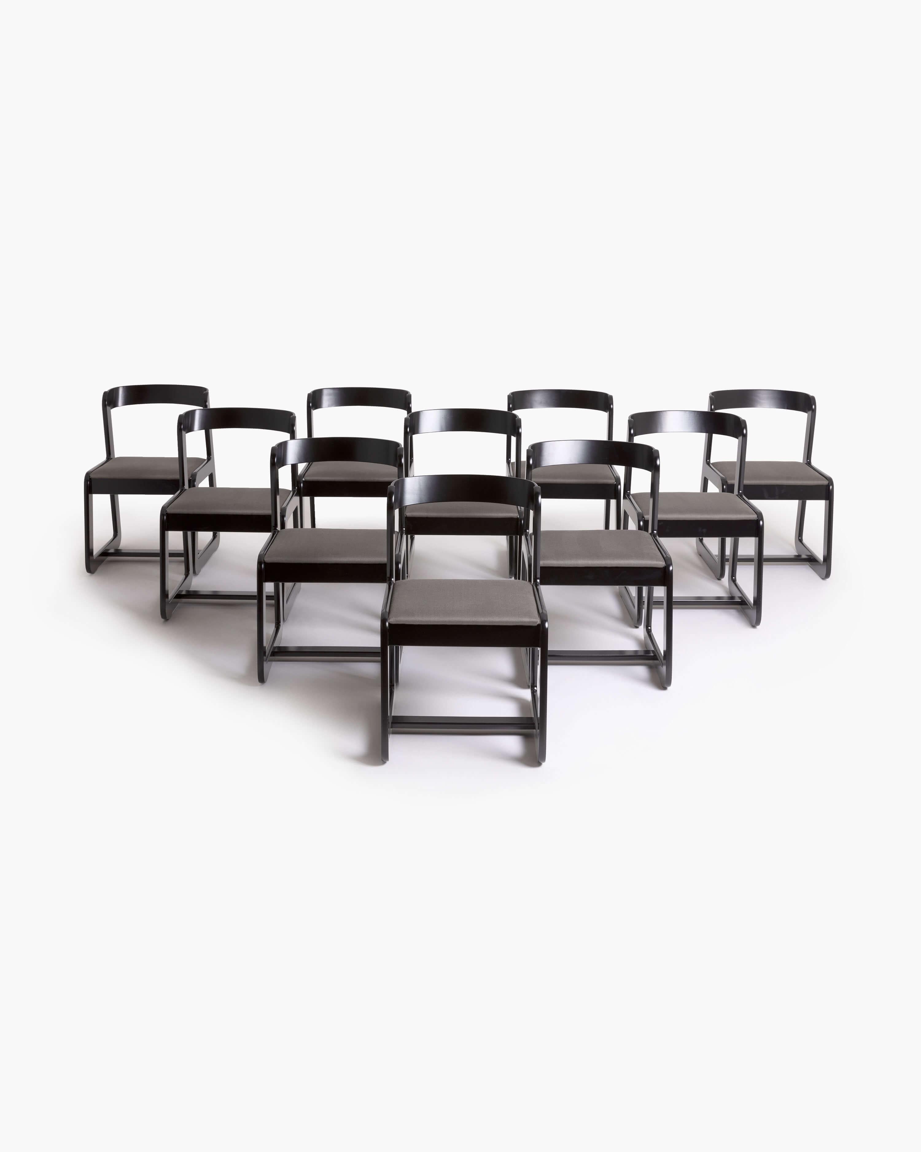 Enhance your dining experience with this exquisite set of ten dining chairs designed for Mario Sabot, circa 1970, in the distinguished style of Willy Rizzo. Crafted with meticulous attention to detail, these chairs feature a striking combination of