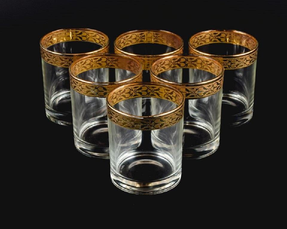 Italian design, six water glasses in clear art glass with gold rim.
Approx. 1960s/70s.
In perfect condition.
Marked.
Dimensions: H 9.0 x 7.5 cm.