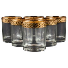 Conception italienne, six verres à eau en verre d'art transparent avec bord doré.
