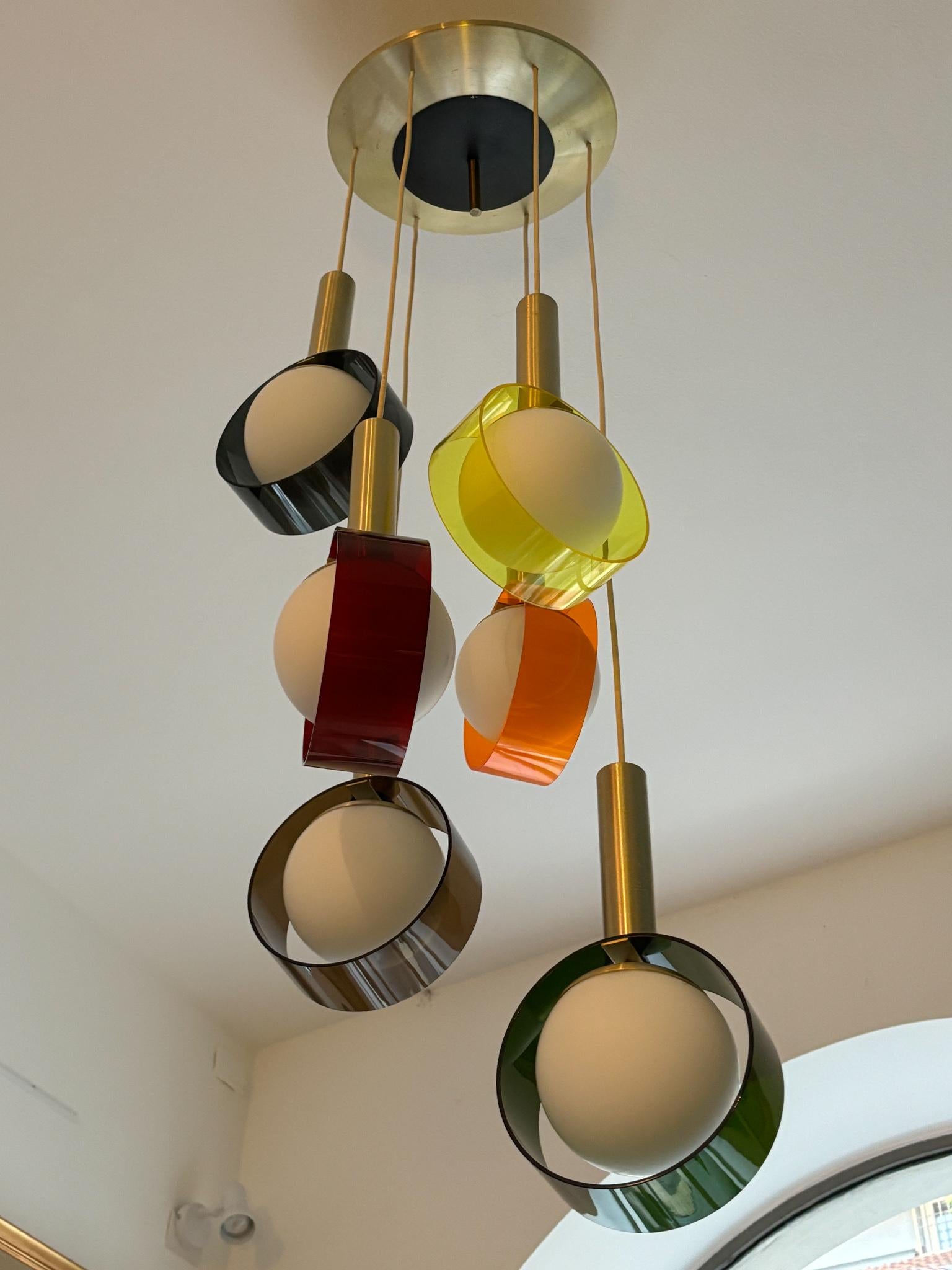 Multicolored Stilux pendant chandelier, made in the 1960s. Brushed anodized aluminium, painted aluminium, satin opal glass, perspex. The suspensions are easily adjustable via knot.

Diffusers -  h 38 cm

Stilux Milano was an innovative lighting