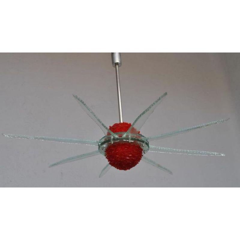 Vintage Italian design chandelier from the 80s in colored glass 8 branches. Dimension height 65 cm for an entire diameter of 94 cm. note that a branch has been glued

Additional information:
Material: Verre & cristal
Style: Vintage 1970.