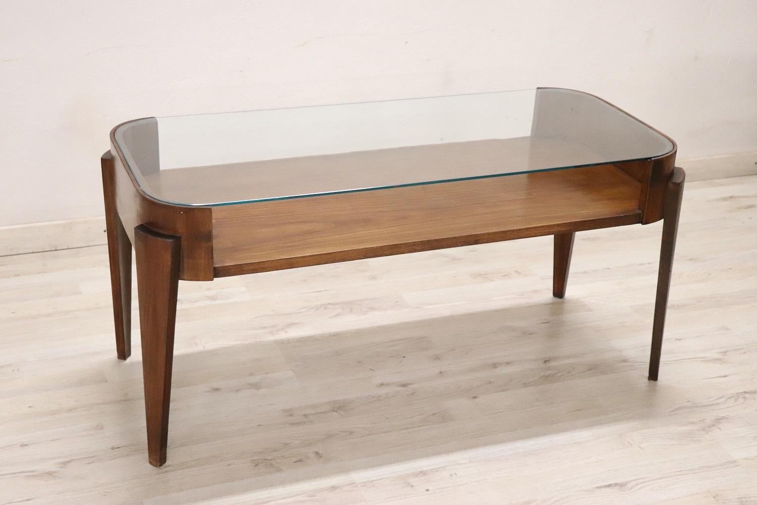fine quality Italian design mid-century coffee table or sofa table. The table is in beech wood and glass top. In vintage good conditions. 
