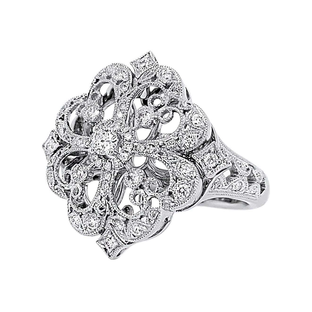 Produced by award winning Italian designer Stefano Vitolo. Stefano creates custom artisanal one of a kind jewelry with excellent gemstones in a truly old world Italian craftmanship.
This handcrafted ring has 0.63 total carat weight of F/G color, and