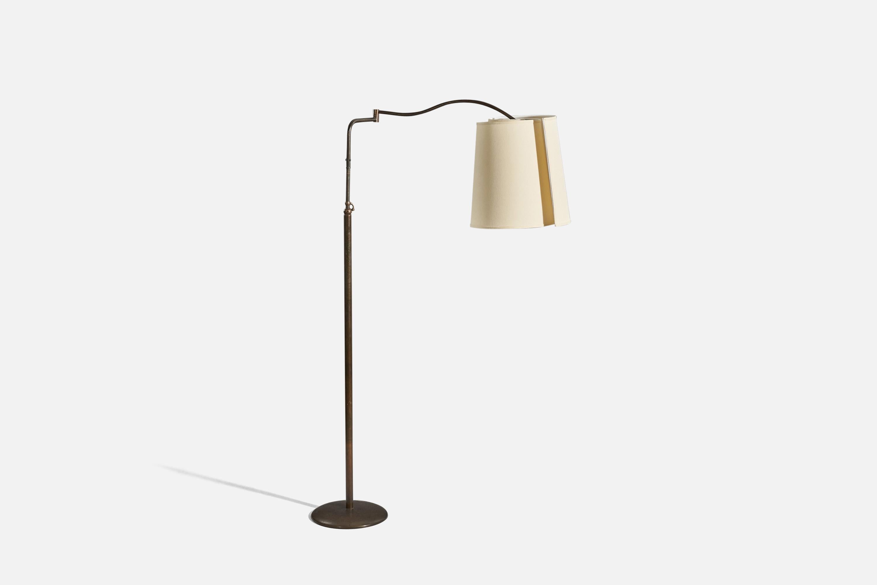 A brass and fabric, adjustable floor lamp designed and produced in Italy, 1940s.

Sold with Lampshade. 
Stated dimensions refer to the Floor Lamp with the Shade. 
Variable dimensions, measured as illustrated in the first image.
 