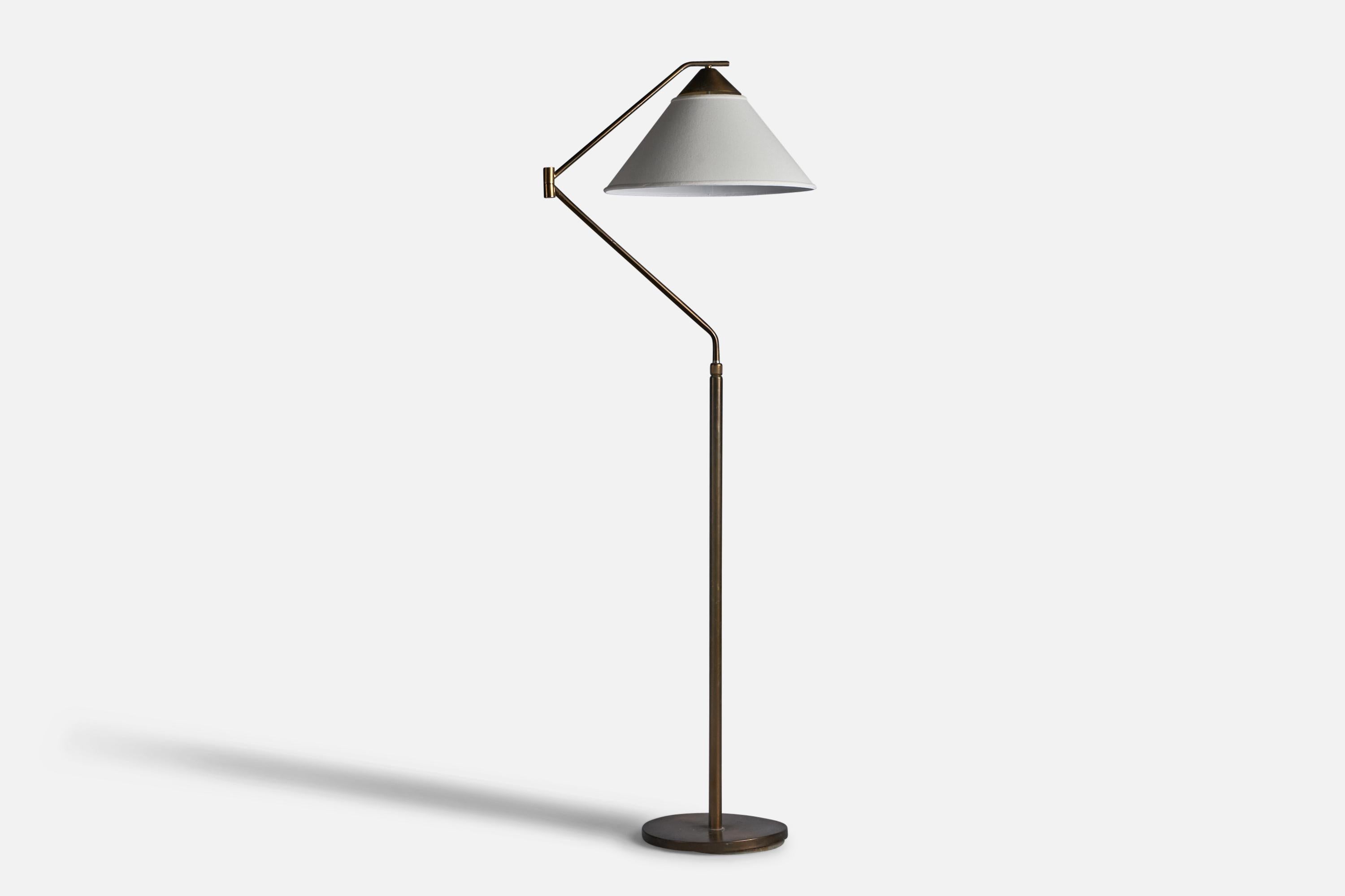 An adjustable brass and white fabric floor lamp designed and produced in Italy, c. 1940s.

Overall Dimensions (inches): 67