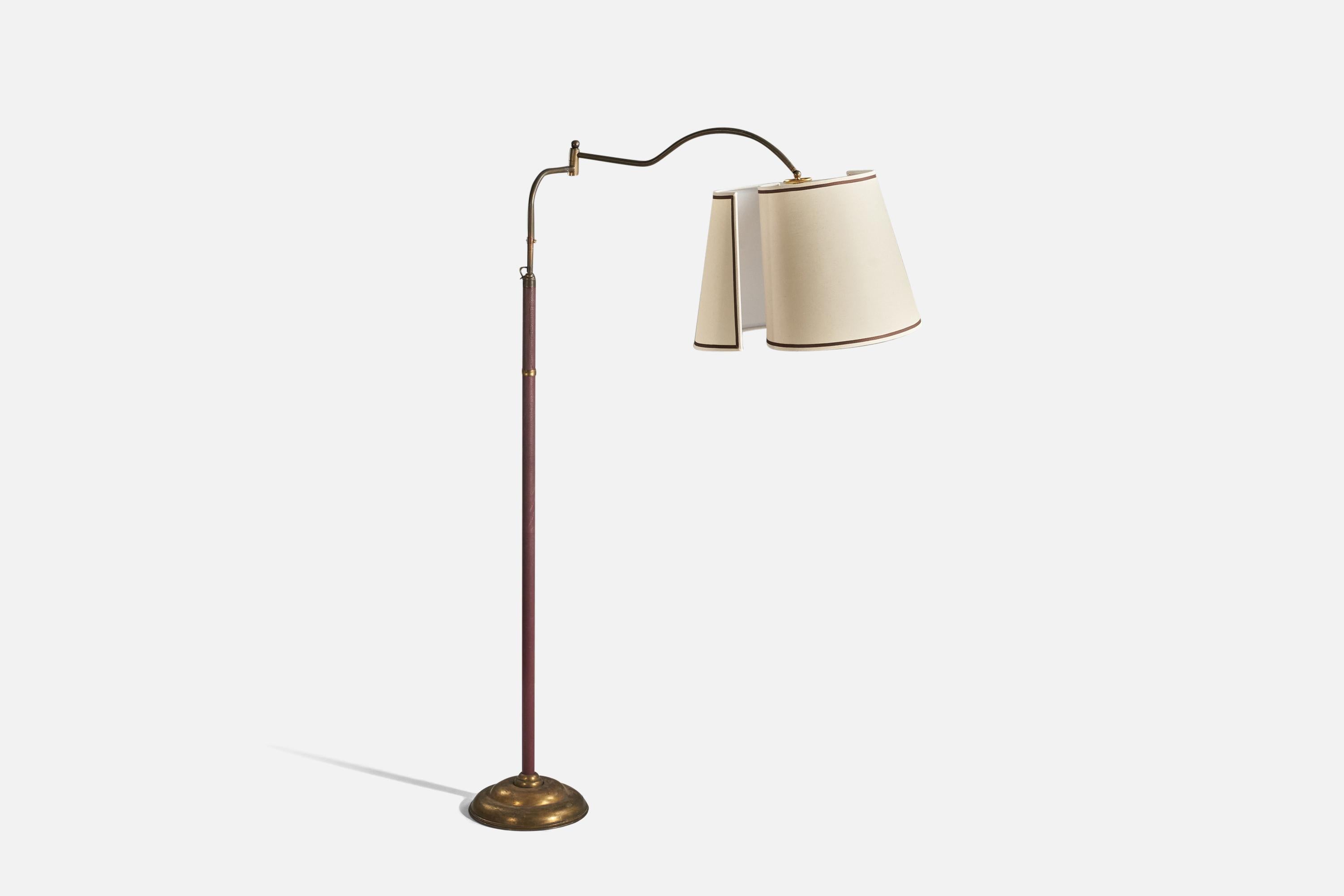 A brass, fabric and red vinyl, adjustable floor lamp designed and produced in Italy, 1940s.

Dimensions variable, fixture measured at maximum extended position.
Sold with Lampshade(s). 
Stated dimensions refer to the Floor Lamp with the