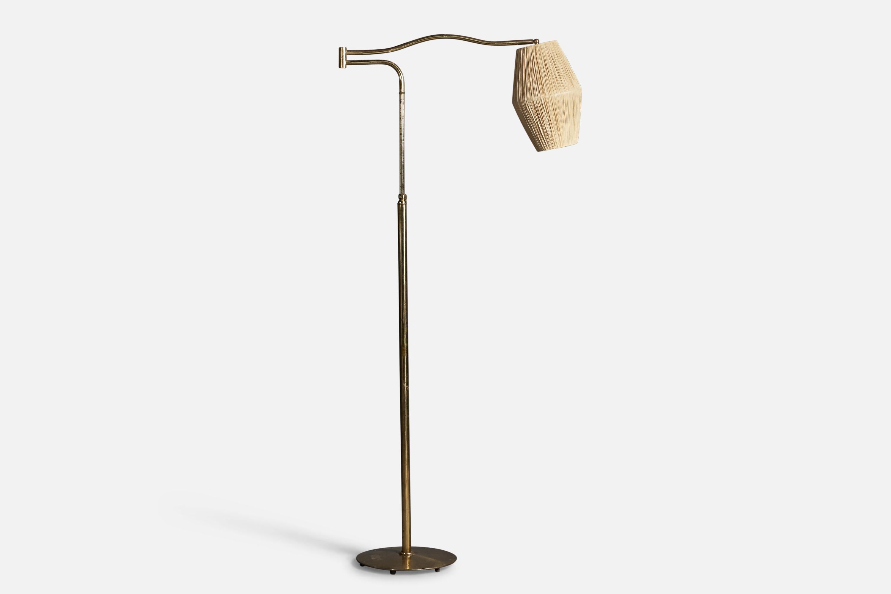 An adjustable brass and raffia floor lamp, designed and produced in Italy, 1940s.

Overall Dimensions: 67.25
