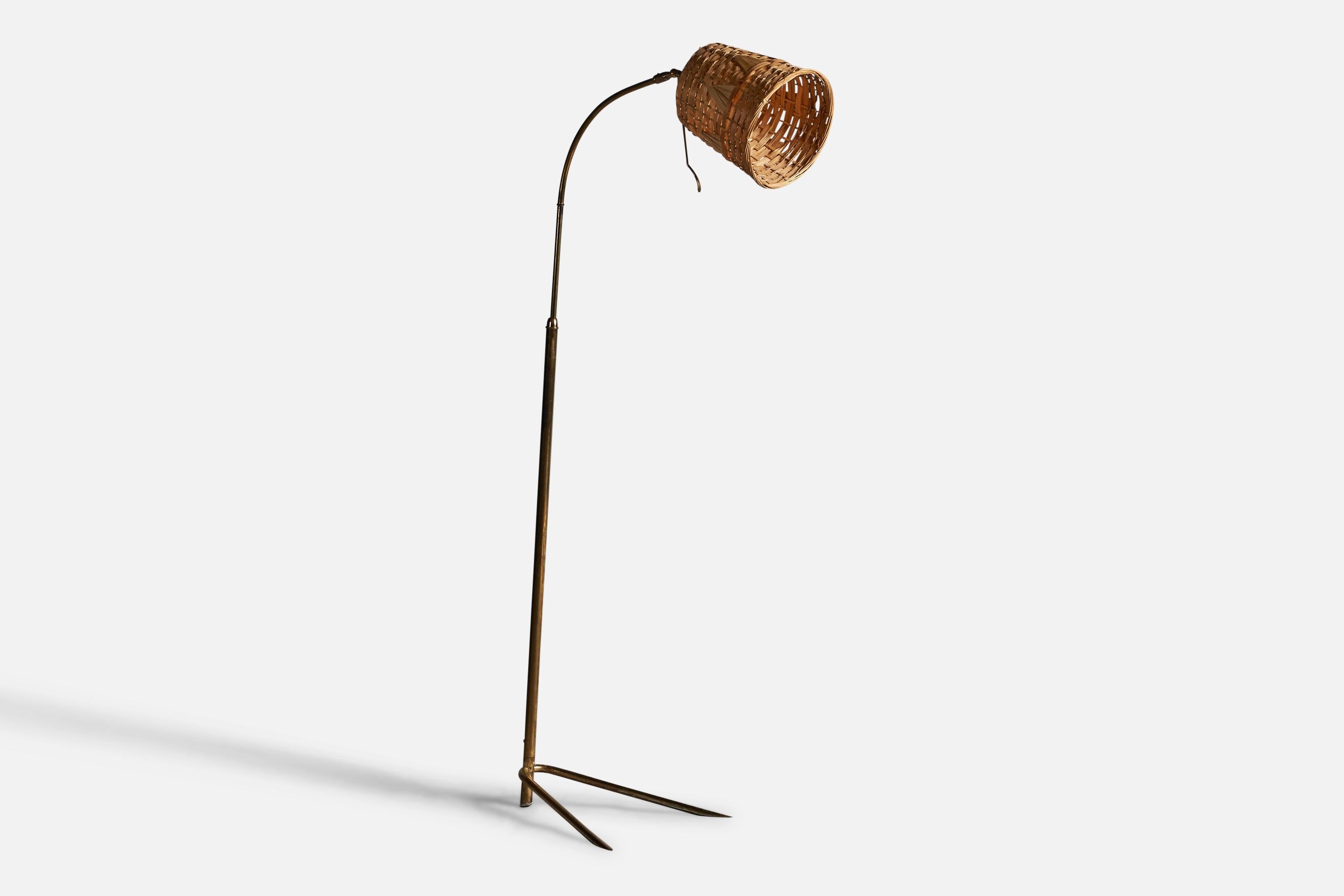 An adjustable brass and rattan floor lamp, designed and produced in Italy, 1950s.

Overall Dimensions (inches): 61.75