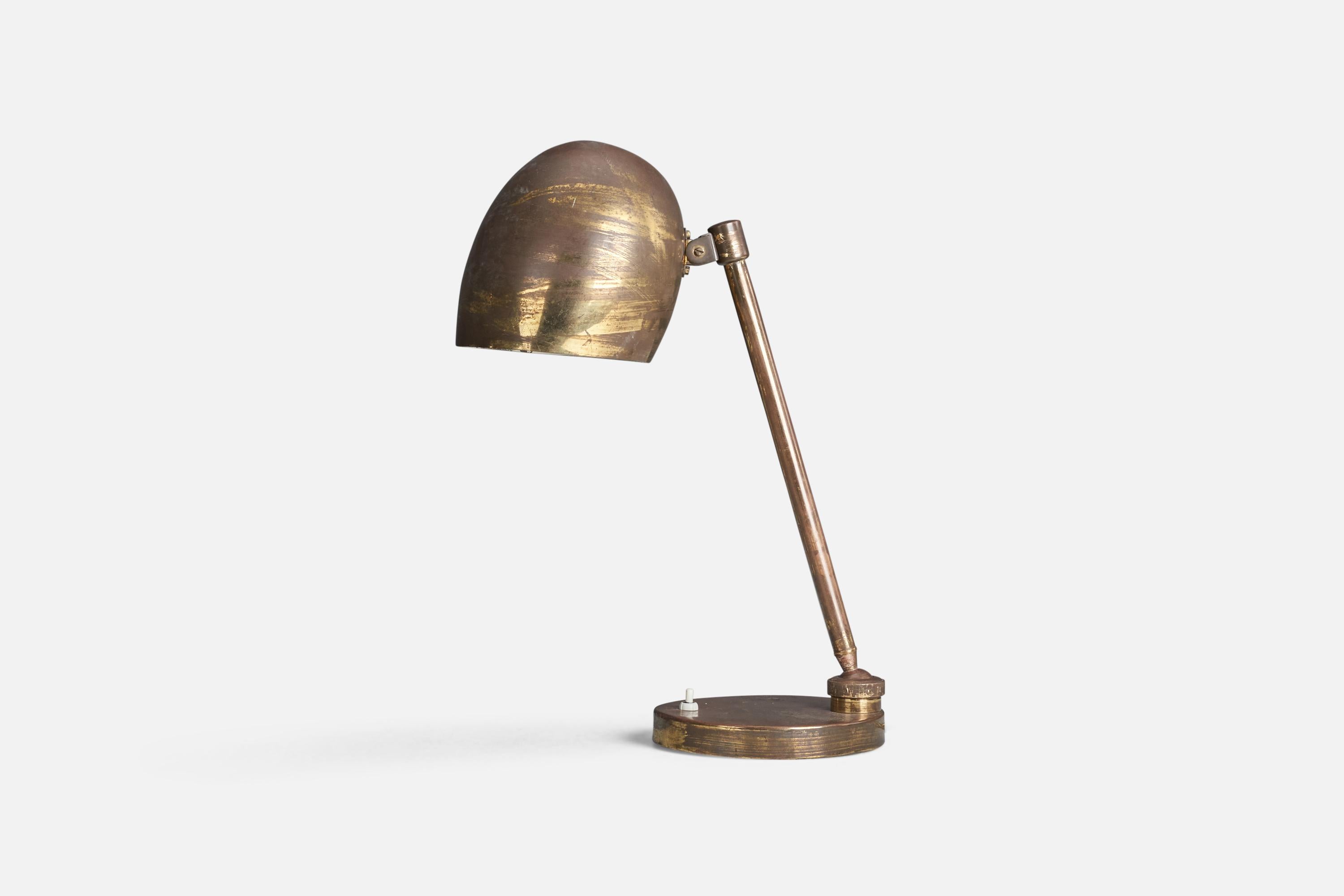 A brass table lamp designed and produced by an Italian Designer, Italy, 1940s.

Socket takes standard E-26 medium base bulb.

There is no maximum wattage stated on the fixture.